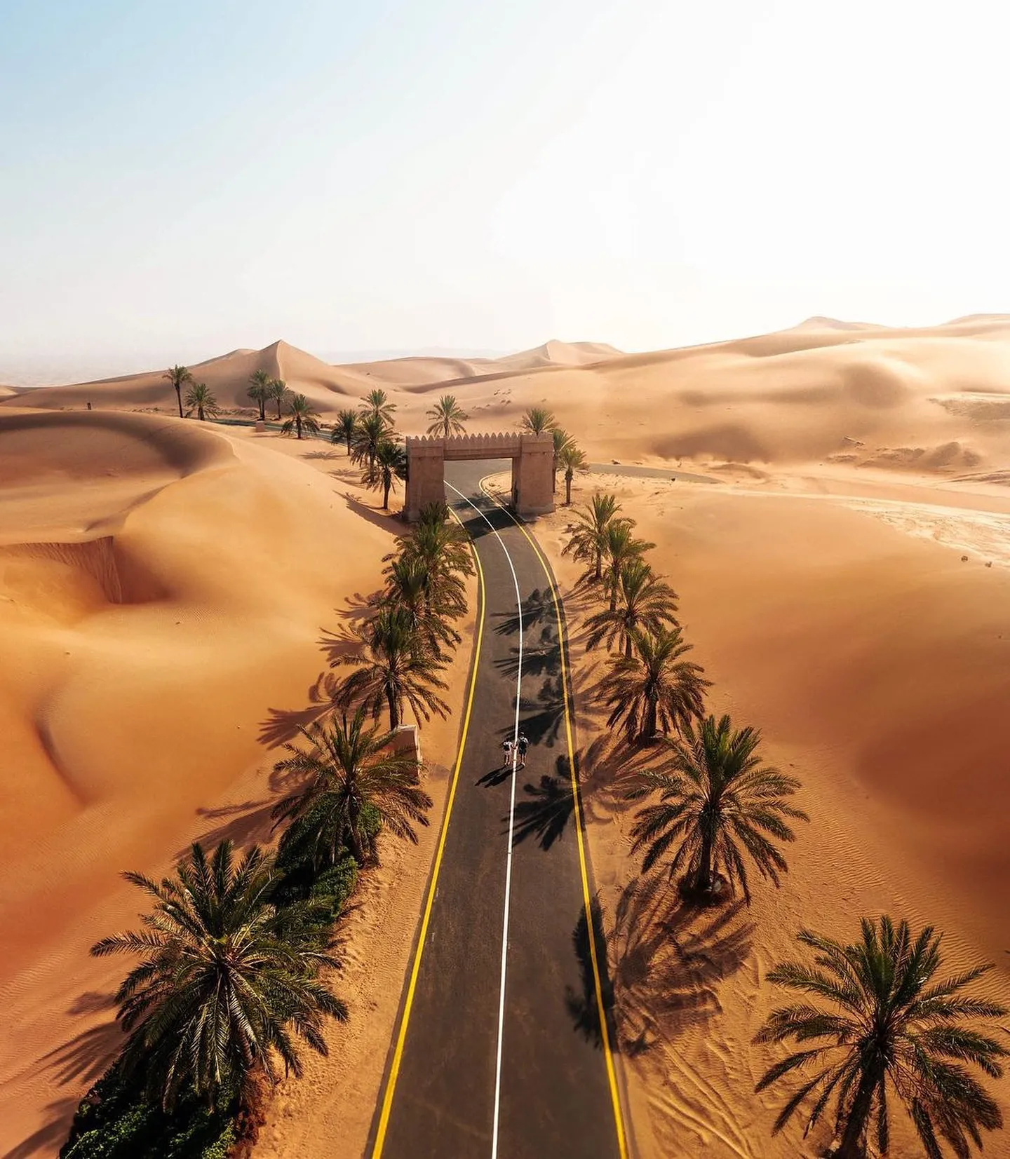 The fortress-style architecture of Qasr Al Sarab resort emerging from the desert