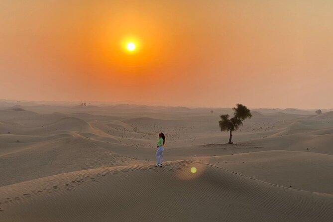 Sunrise over the Al Khatim dunes during a private Abu Dhabi desert safari