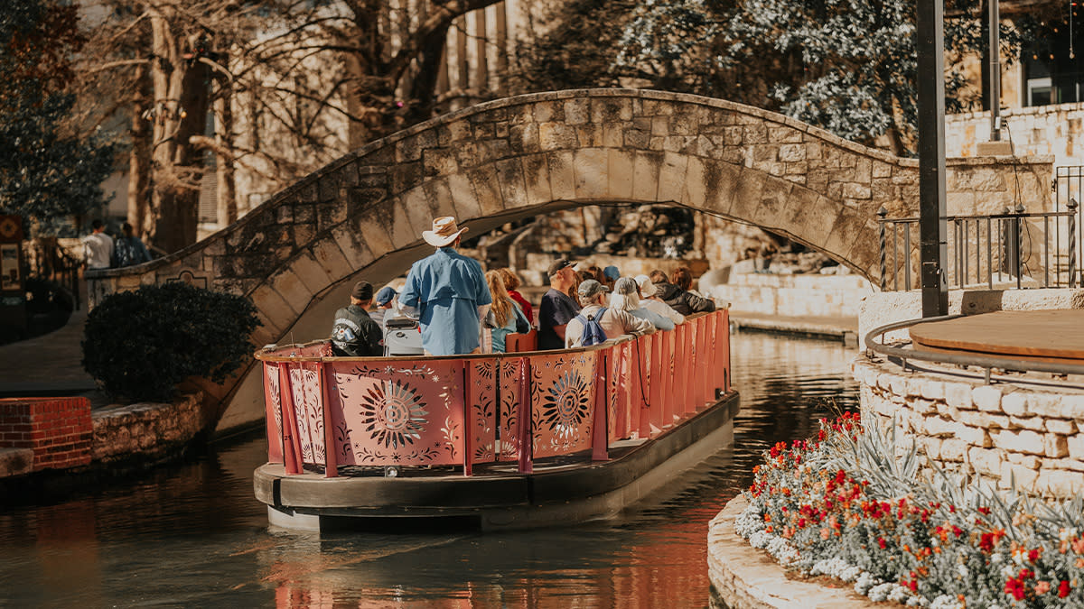San Antonio River Walk with restaurants and river boats