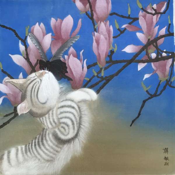 Cat with butterfly and magnolia tree