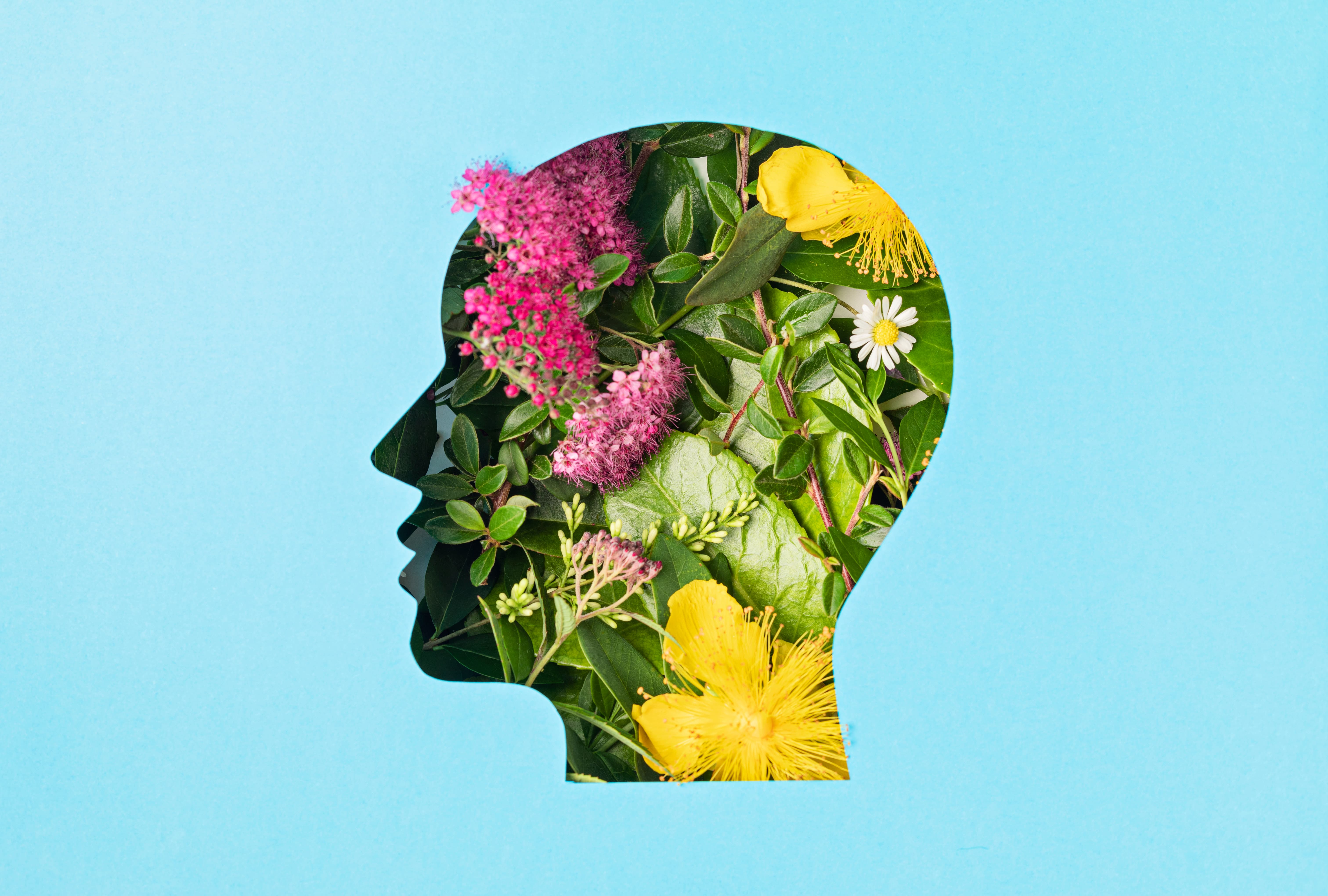 Papercut Head With Green Leaves and Flowers