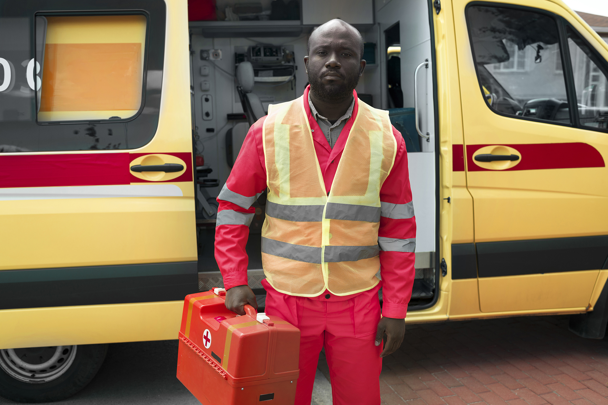 Black man holding emergency kit