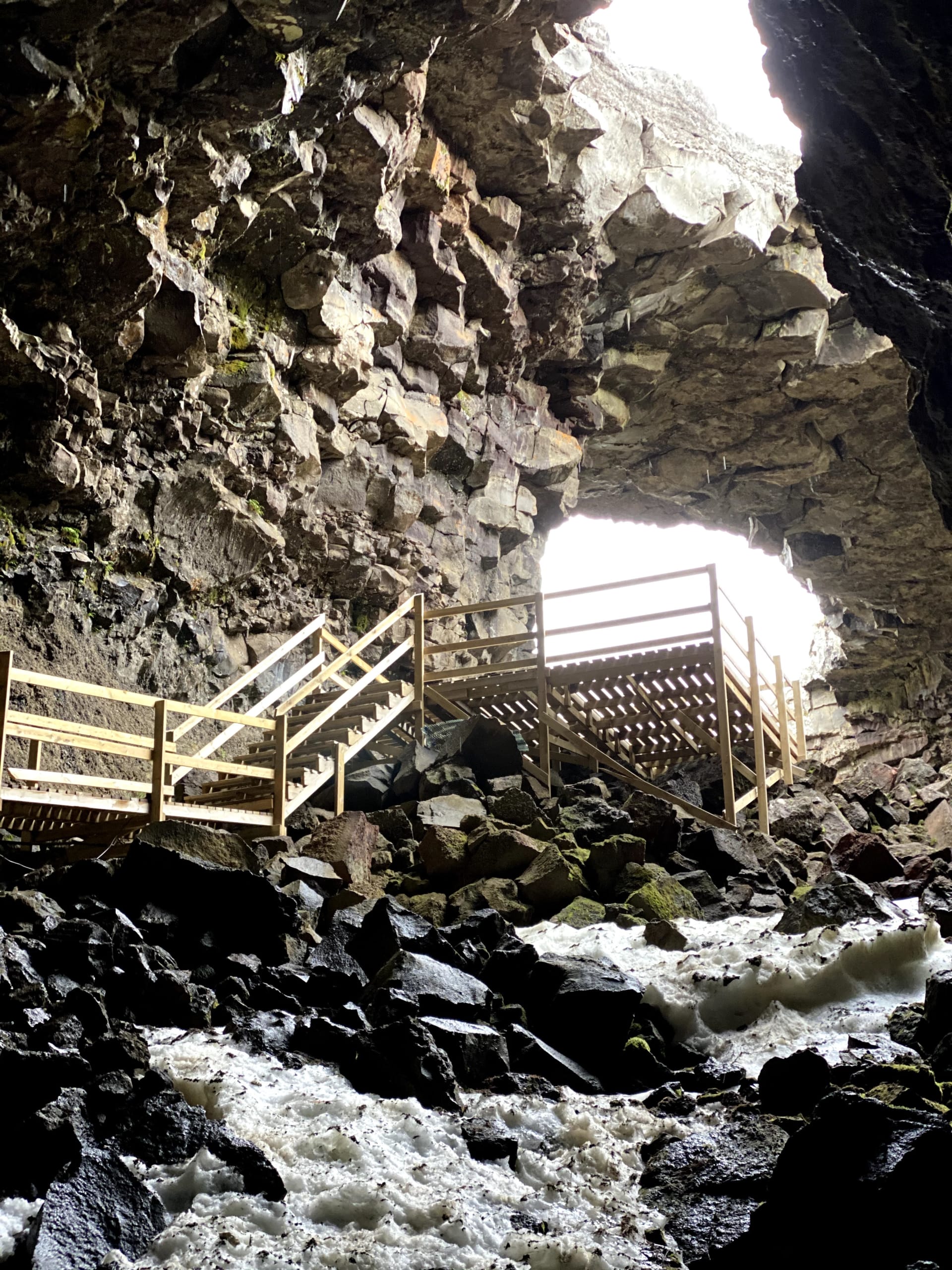 Interior of Víðgelmir Lava Cave showing colorful mineral formations