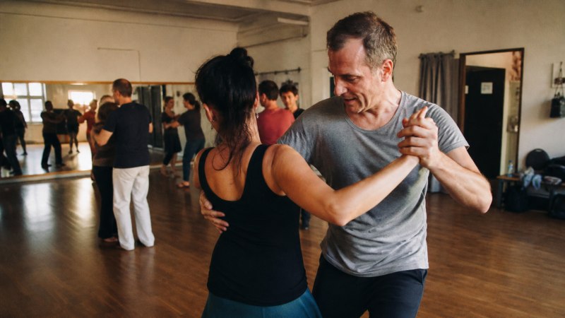 Warming up together and spotting each other in the club creates the trust that is essential for demanding figures on stage.