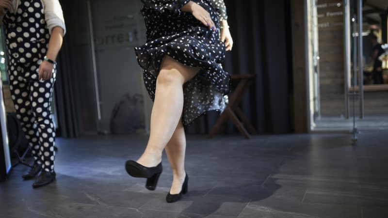 Close-up of a woman's legs dancing on a dance floor