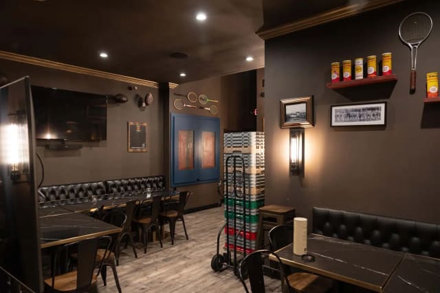 Private back room with TVs at Over Under