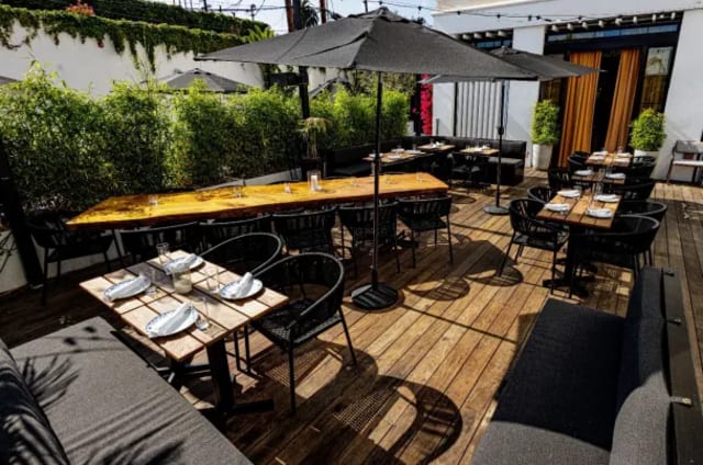 Ladyhawk Patio  at Kimpton La Peer Hotel
