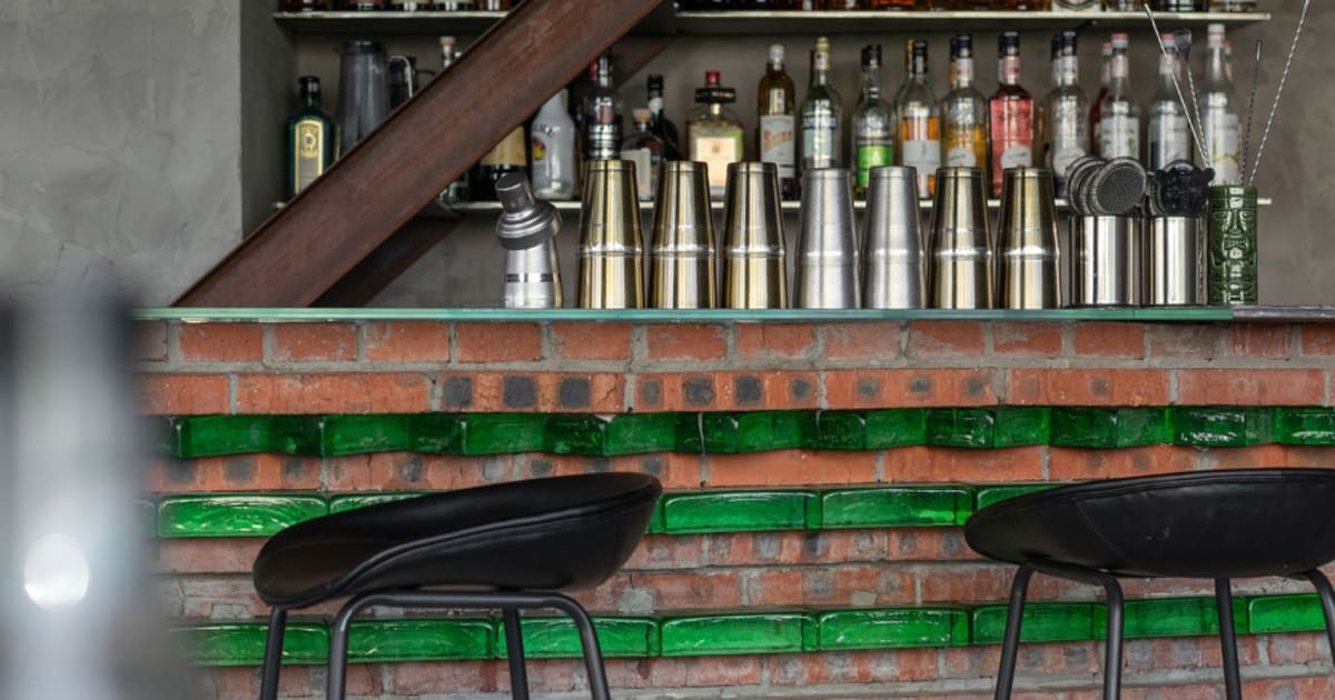 Modern Bar Counter with Brick, Concrete, and Green | Feel Design