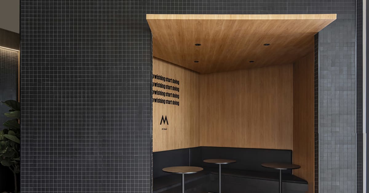 Modern Cafe Booth with Black Tiles and Wooden Floo | Feel Design