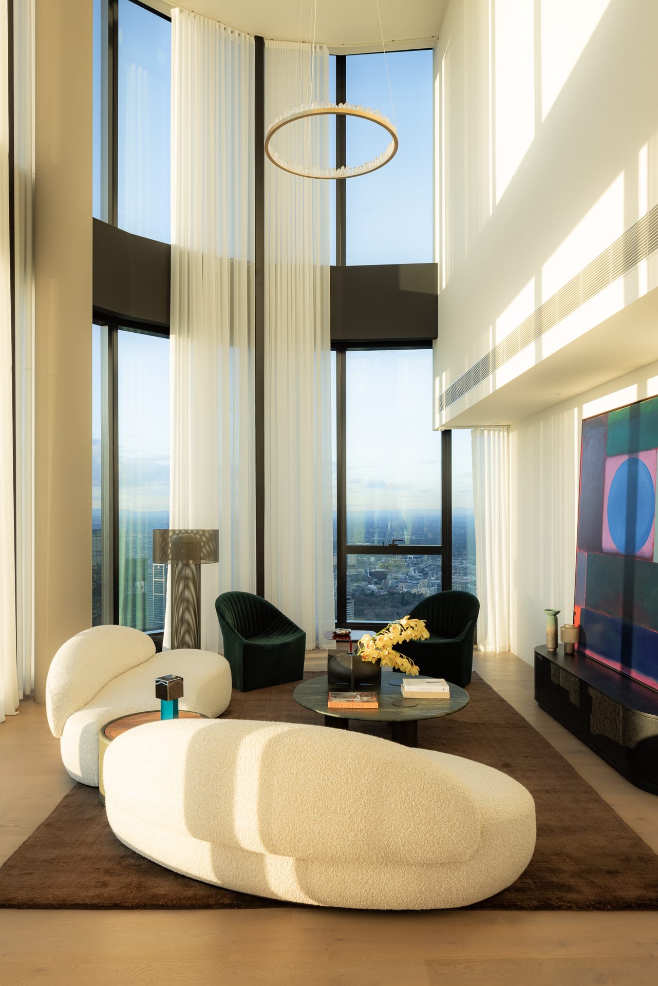 Modern bright apartment living room with large windows and natural light