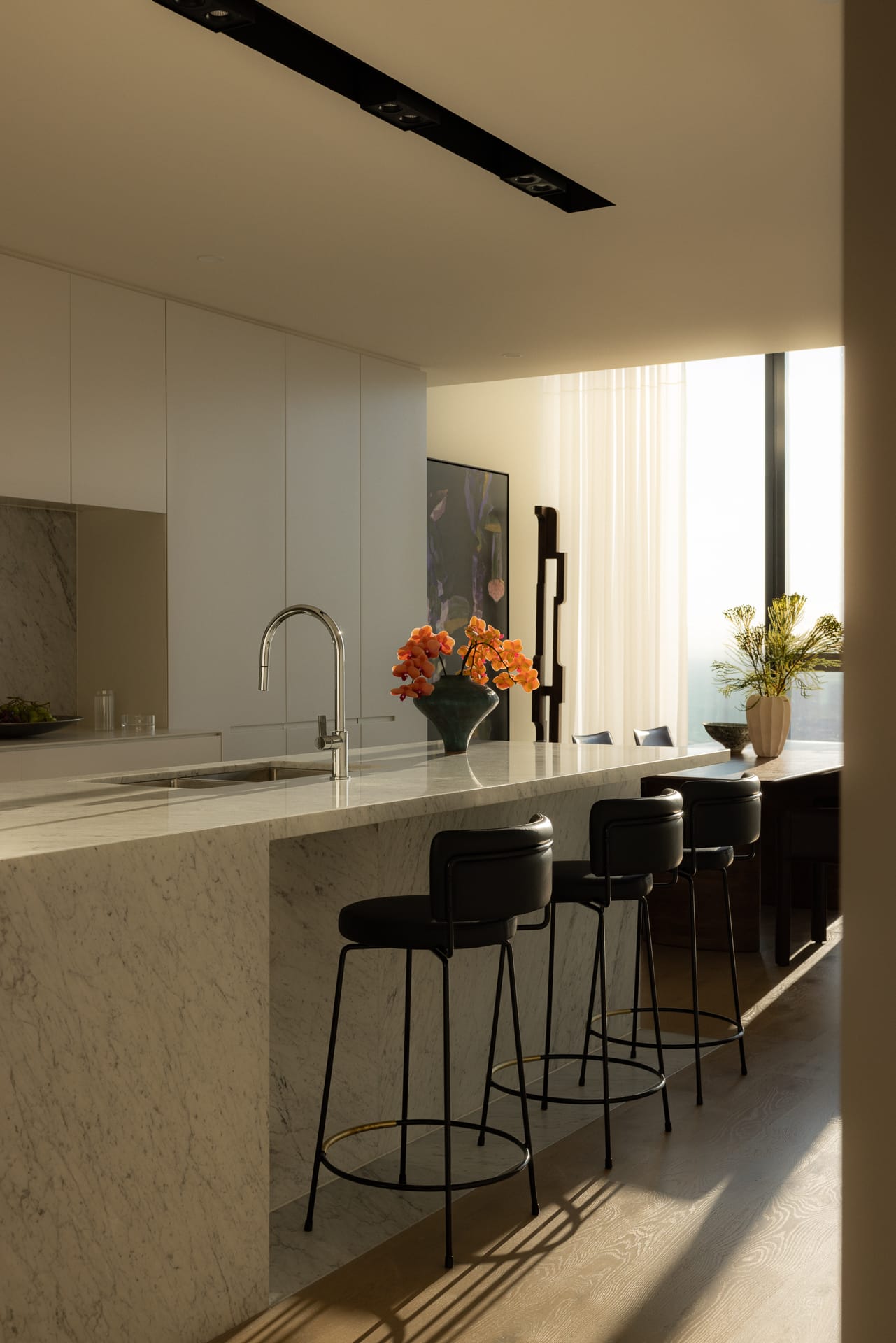 Modern kitchen with white quartz countertops and contemporary design