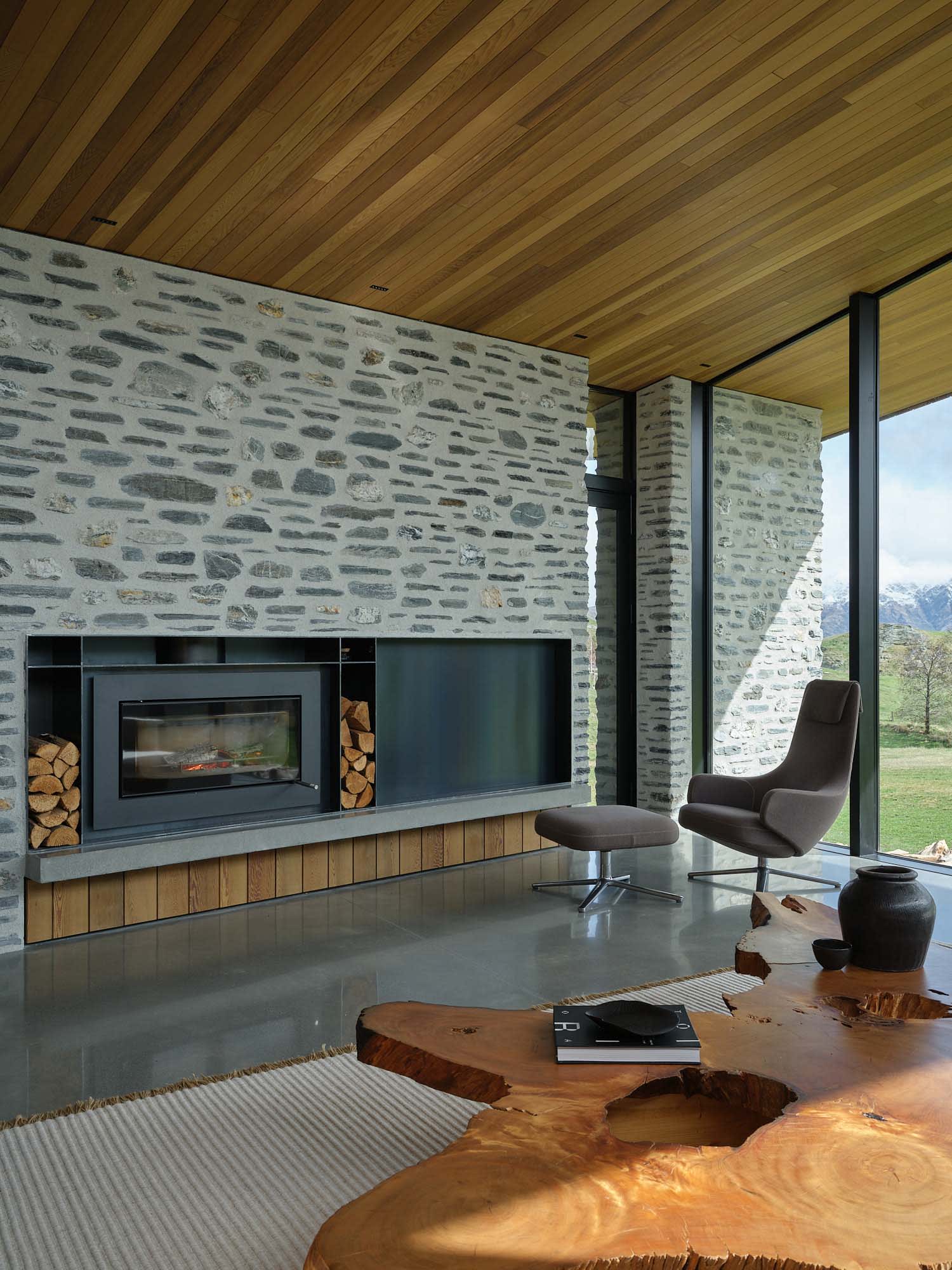 Contemporary farmhouse living room with natural materials stone and wood