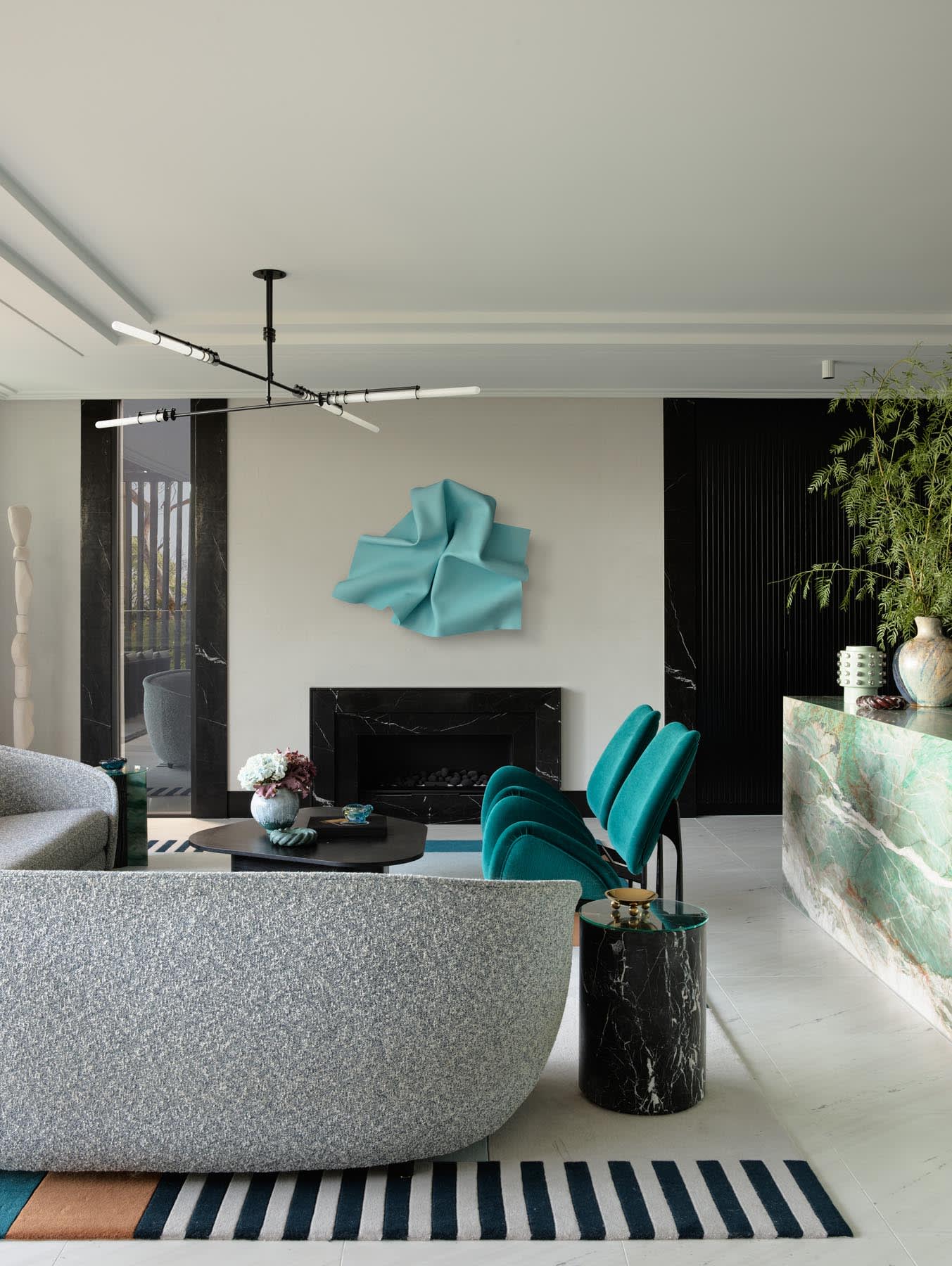 Elegant teal blue green living room with modern furniture and sophisticated design