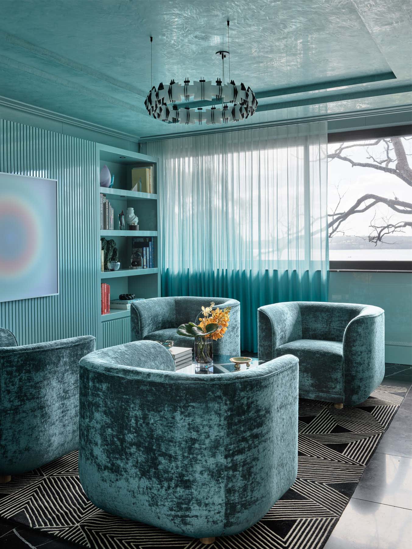 Modern living room featuring teal color palette with elegant furniture