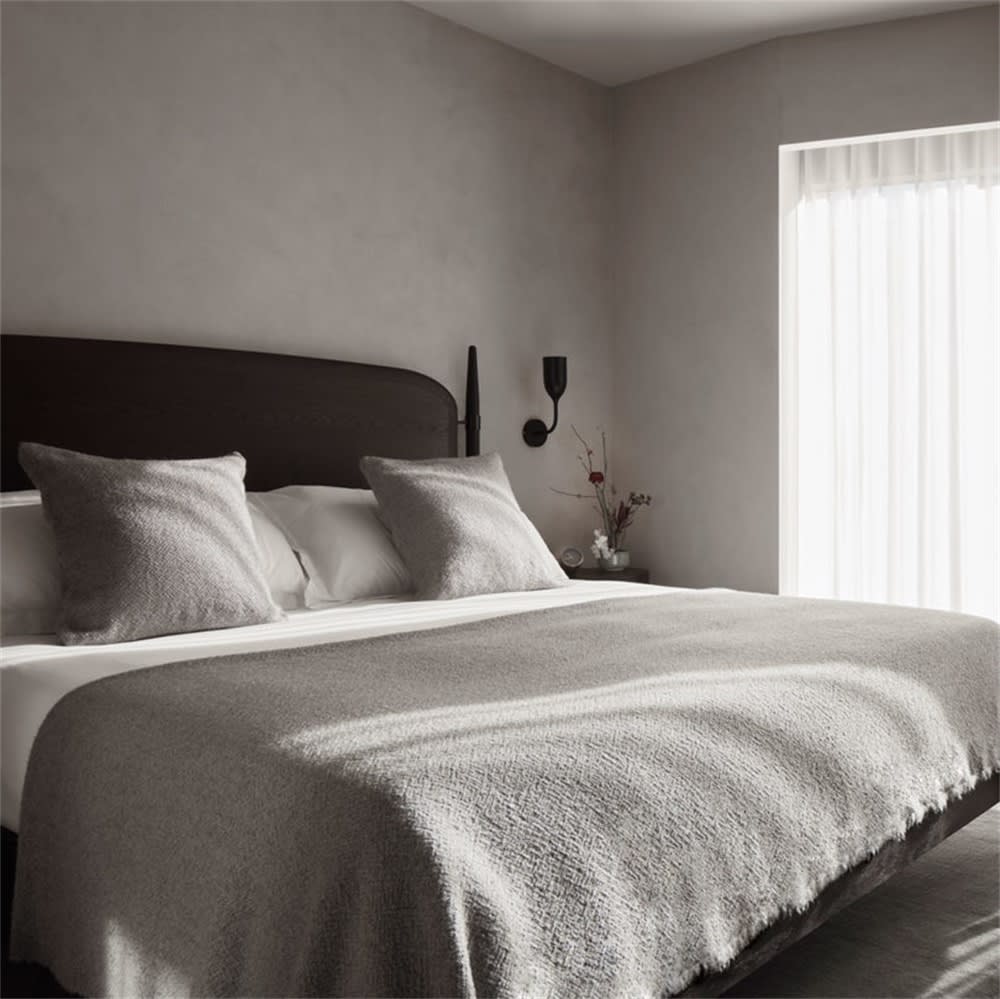 Modern organic bedroom with oak, linen, and warm neutral layering