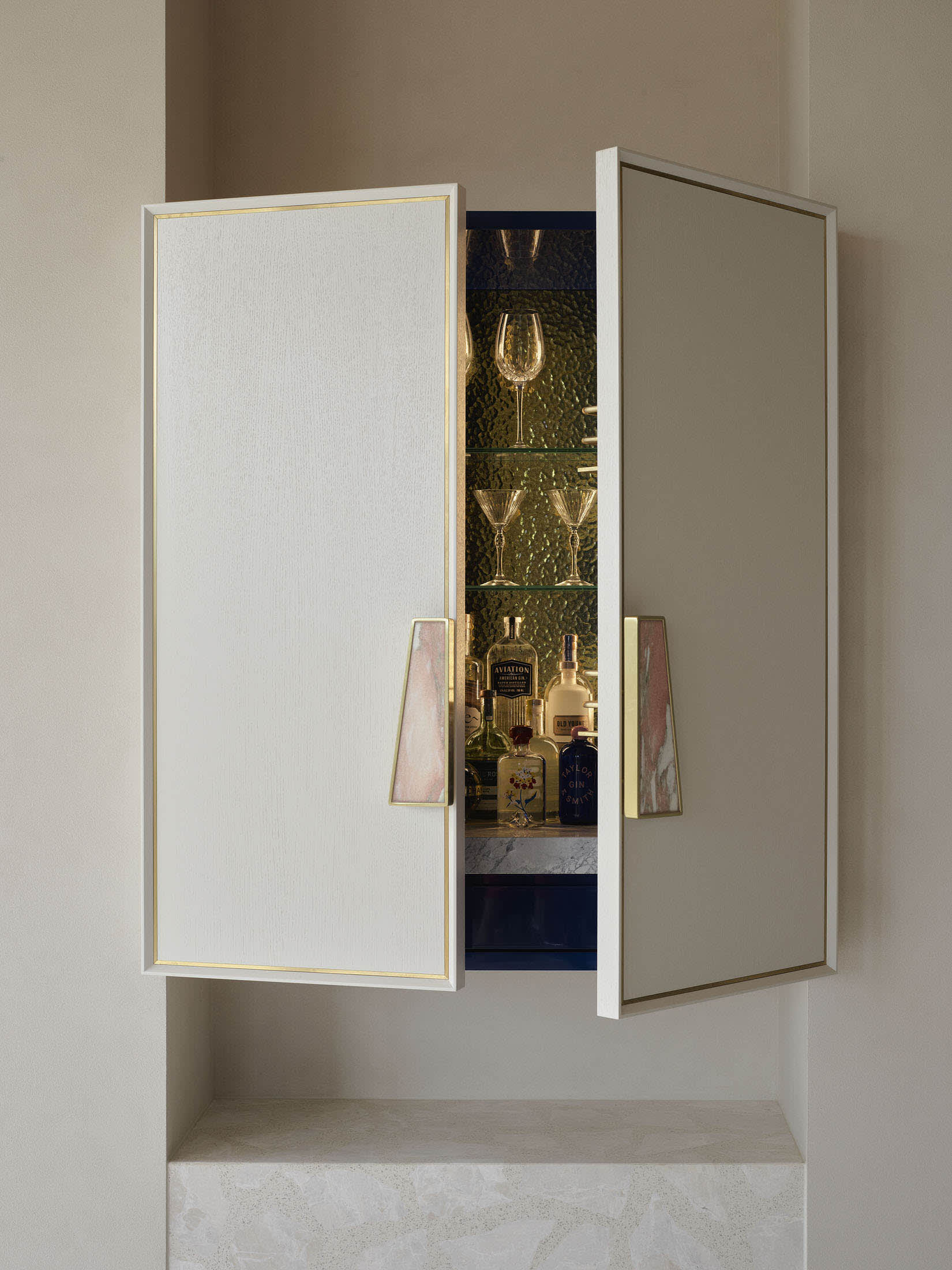 Art deco interior featuring brass accents and sophisticated material layering