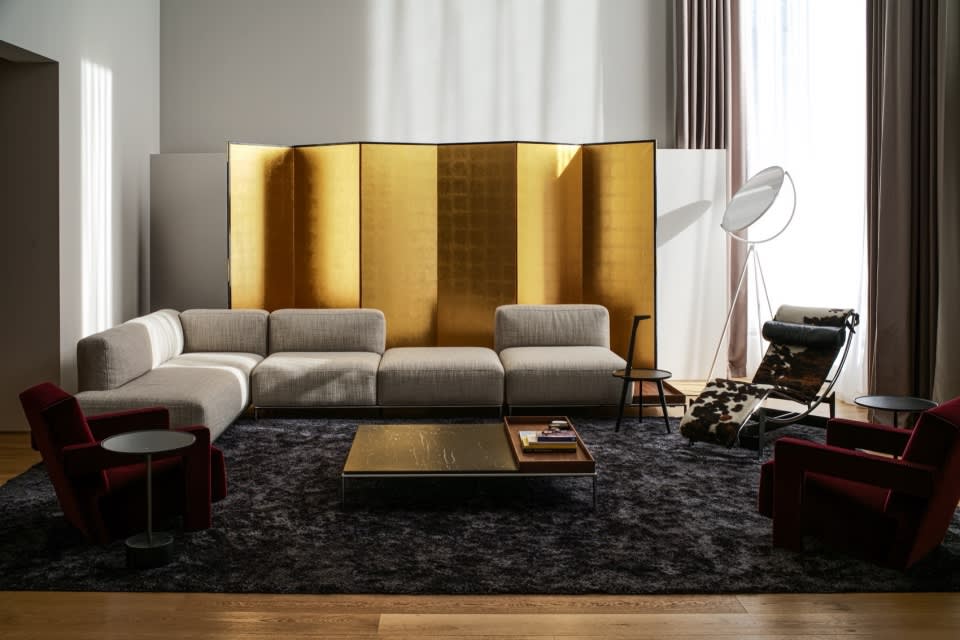 Art deco modern living room with velvet sofa brass gold accents elegant luxury interior