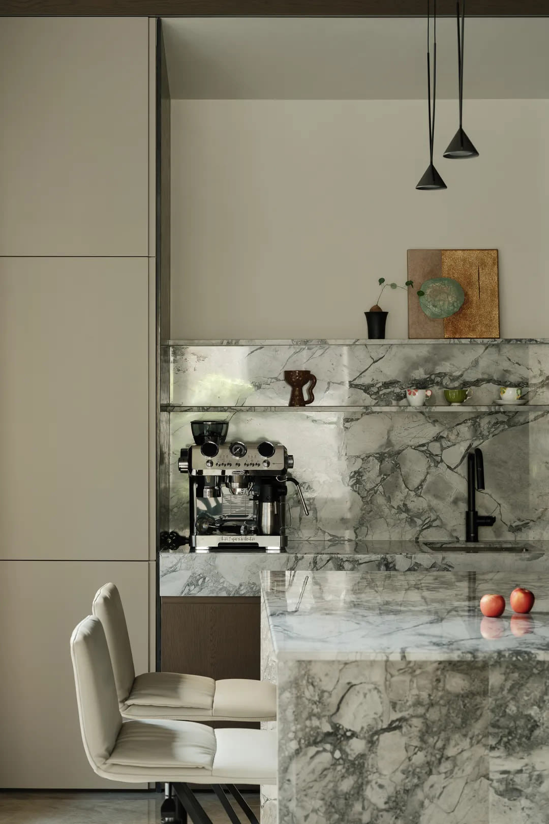 Contemporary kitchen with art deco influenced design elements and geometric tile patterns