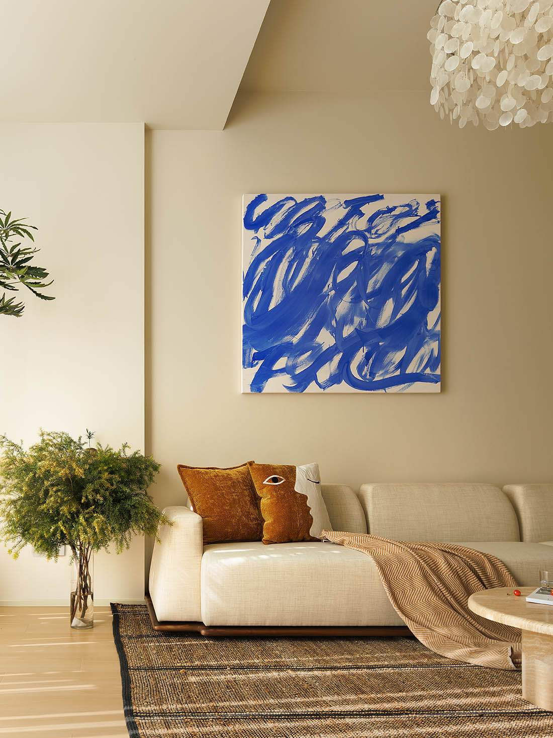 Contemporary interior with artistic wall treatment and warm tones