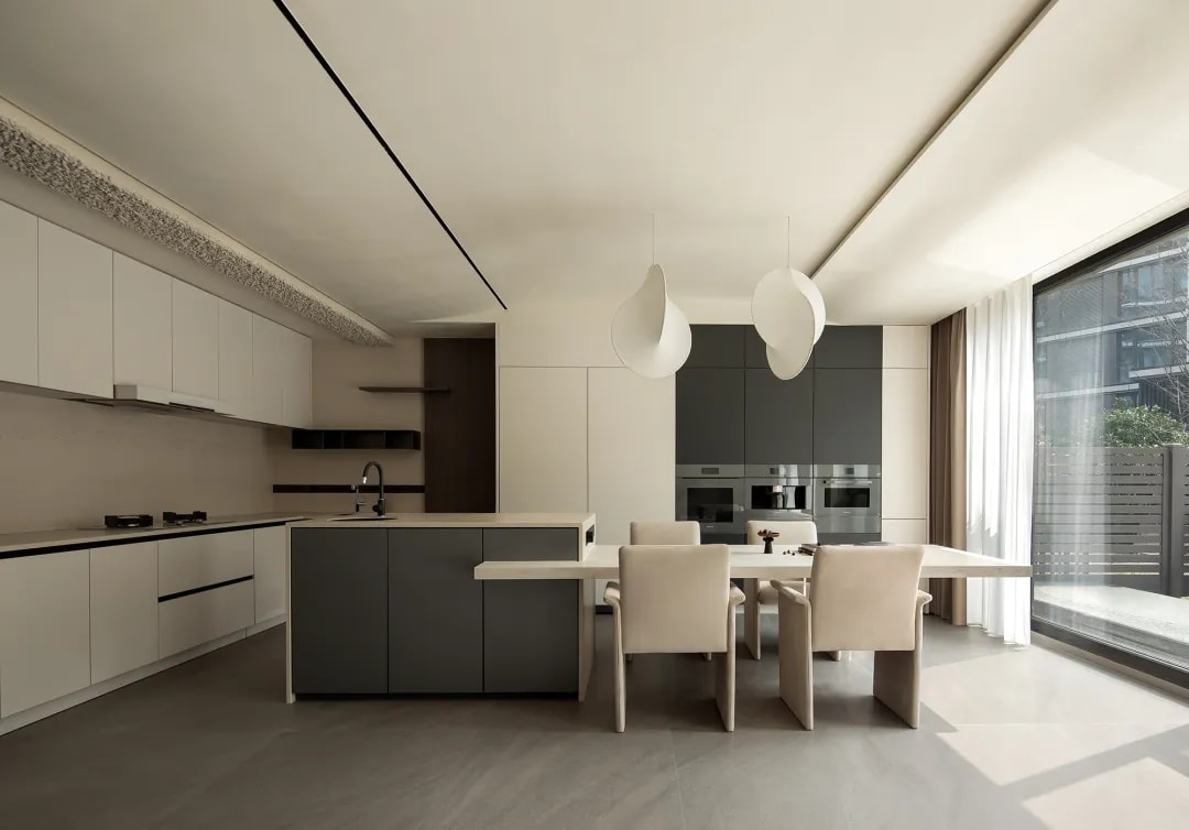 Contemporary kitchen interior with neutral tones and clean countertop design