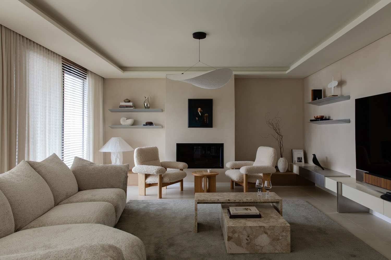 Minimalist interior with warm wood tones and natural light streaming through large windows