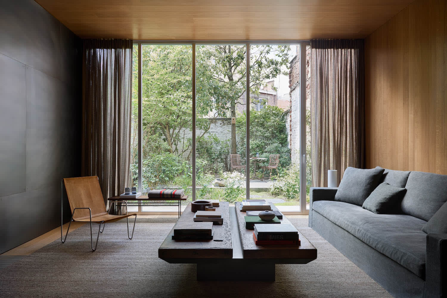 Brown leather sofa living room warm neutral tones contemporary design