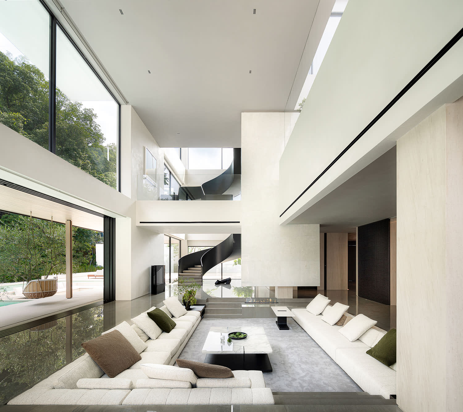Modern home with floor to ceiling energy efficient windows flooding interior with natural light