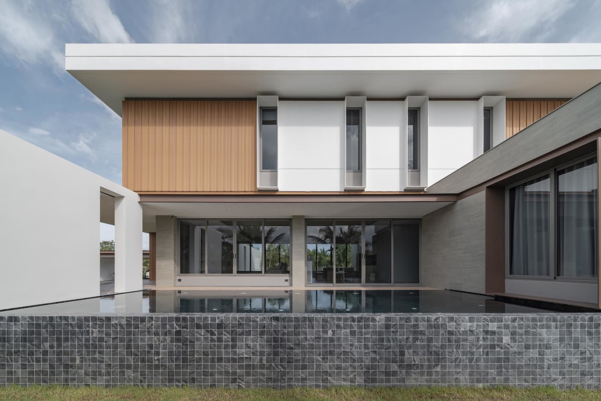 Modern residential home featuring concrete ledges on the exterior facade.