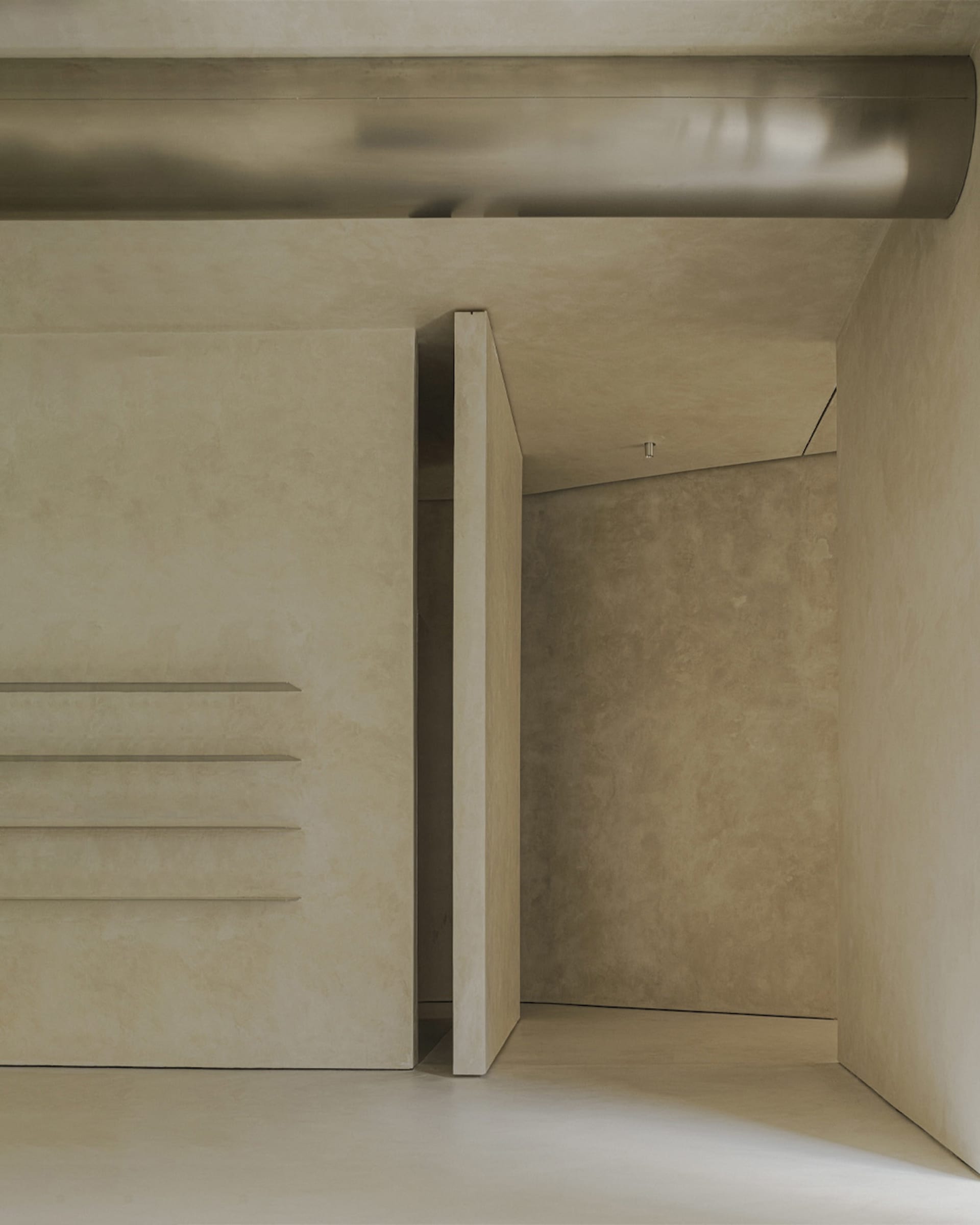 A minimalist concrete space with a smooth, polished floor and walls, featuring a floating wooden shelf.