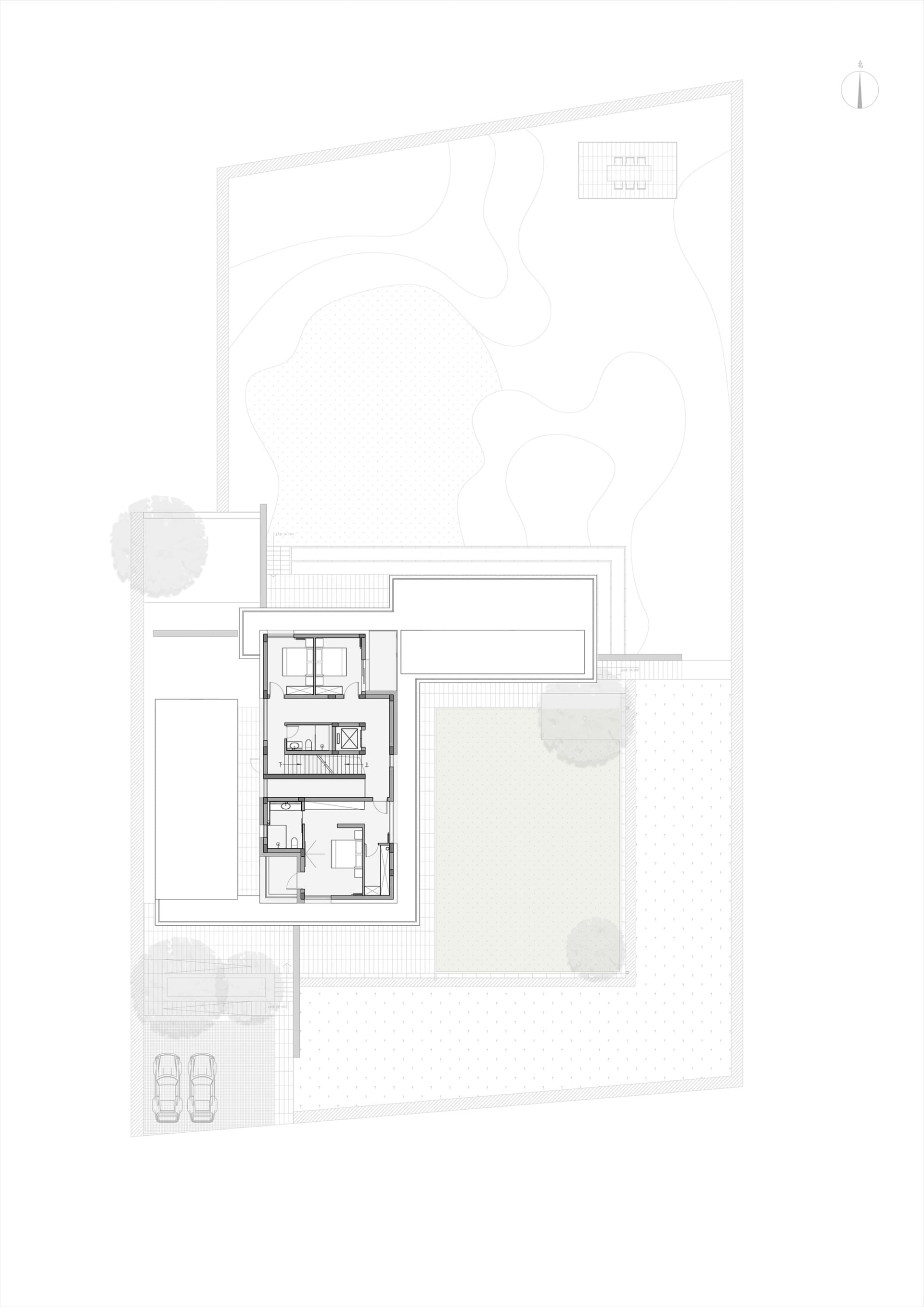 Floor plan of a minimalist residential house featuring concrete and glass materials.