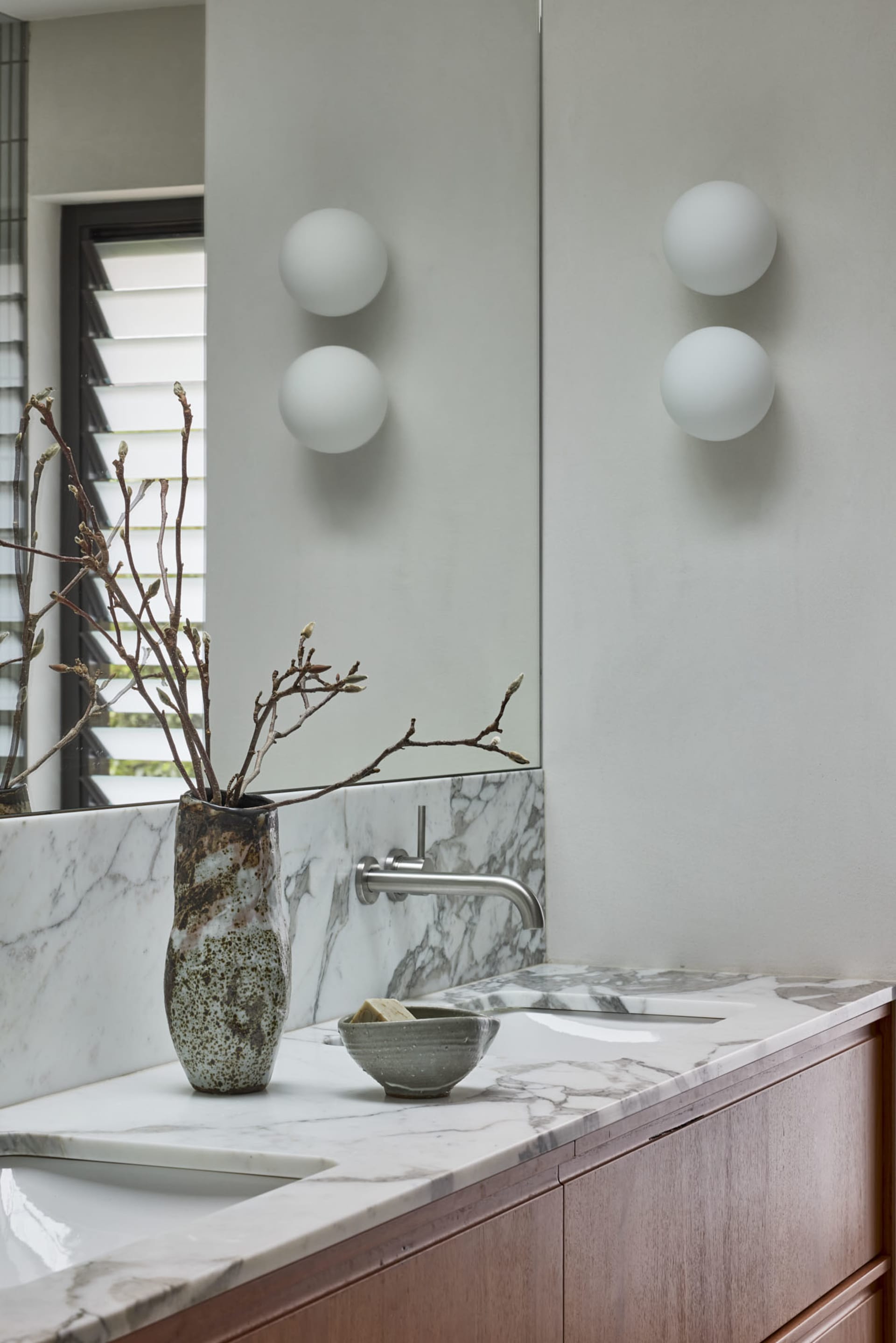 Modern minimalist marble bathroom with minimalist design and white marble countertop, showcasing sleek, contemporary style an