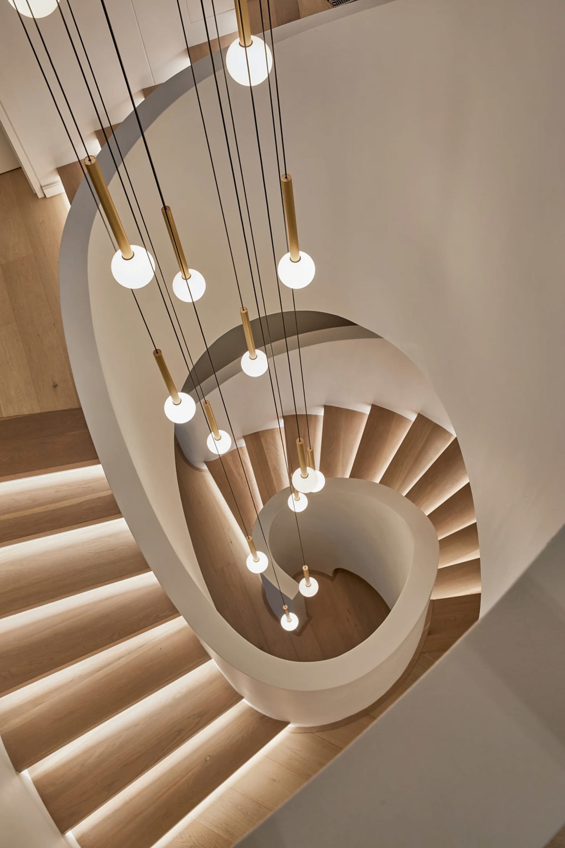 Industrial-style staircase with modern lighting design.