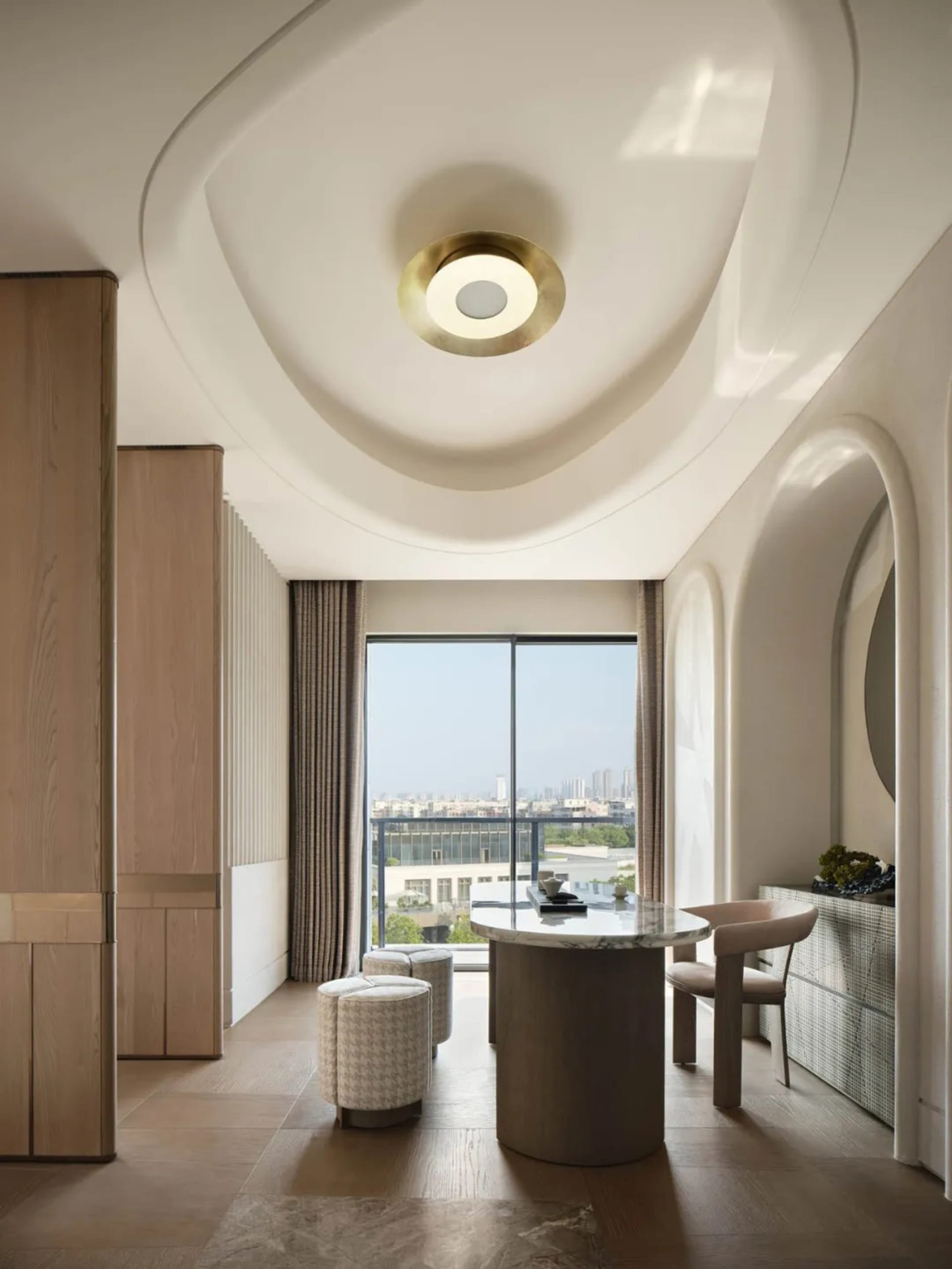 Modern interior design featuring wood, marble, and glass materials.