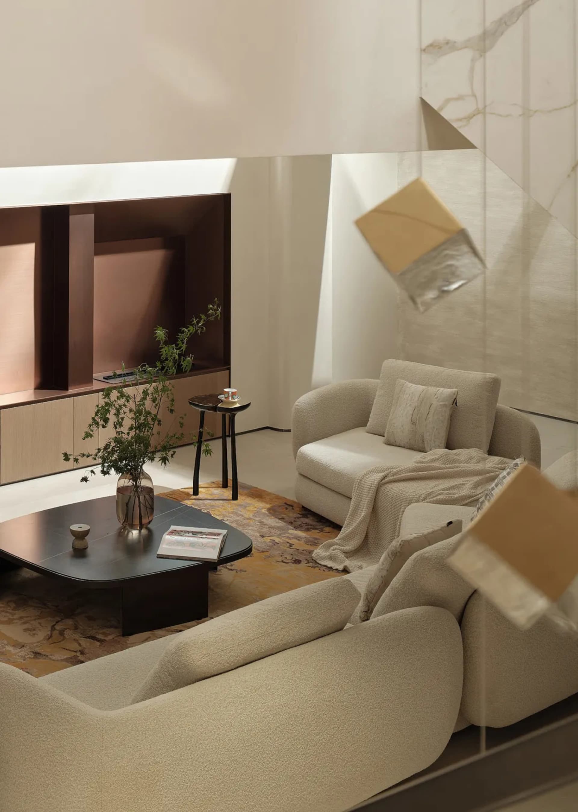 A modern living room featuring a beige couch with textured fabric, a dark wooden coffee table with a vase, and a wall-mounted