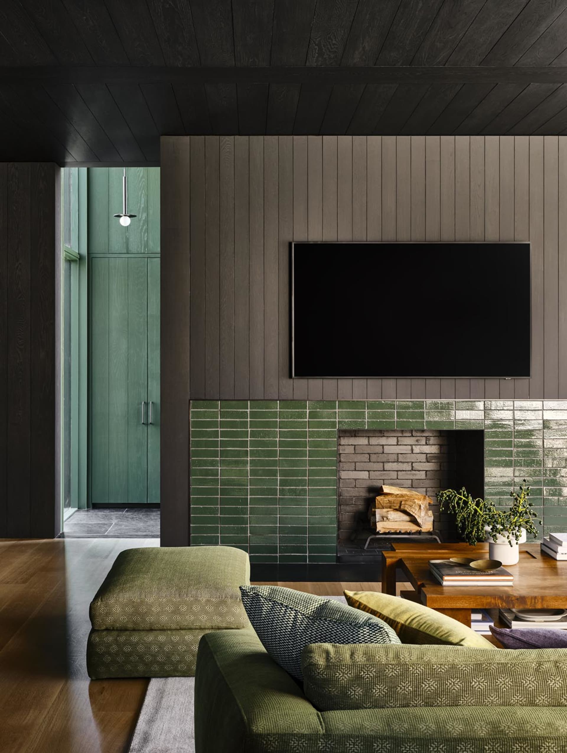Modern living room featuring wooden tiles and concrete accents.