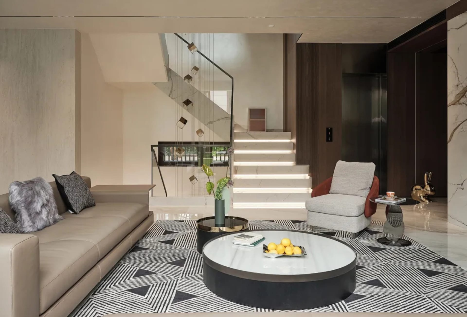 Modern living room featuring marble accents, leather furniture, and wood elements.