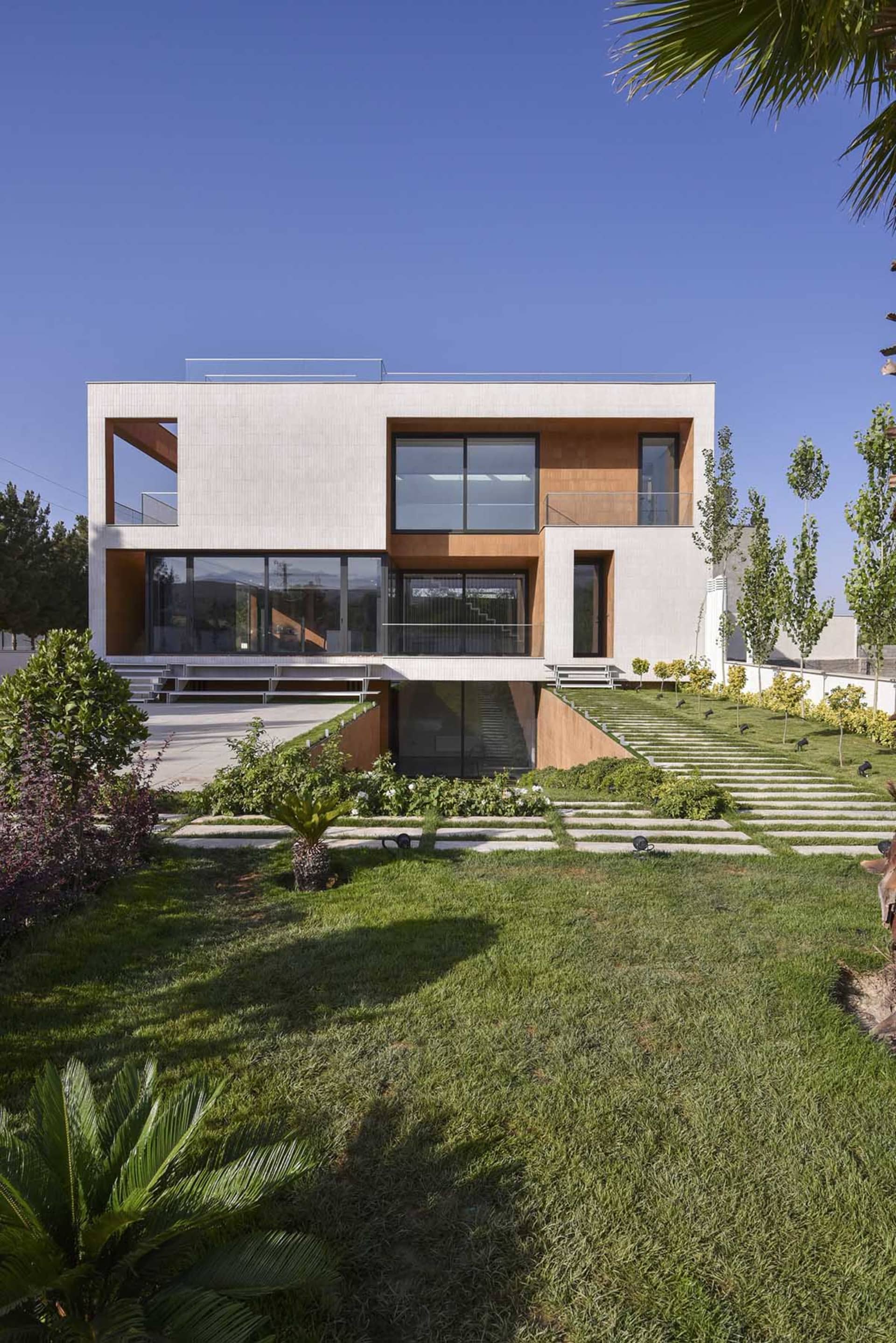 A modern house exterior with concrete and glass materials.