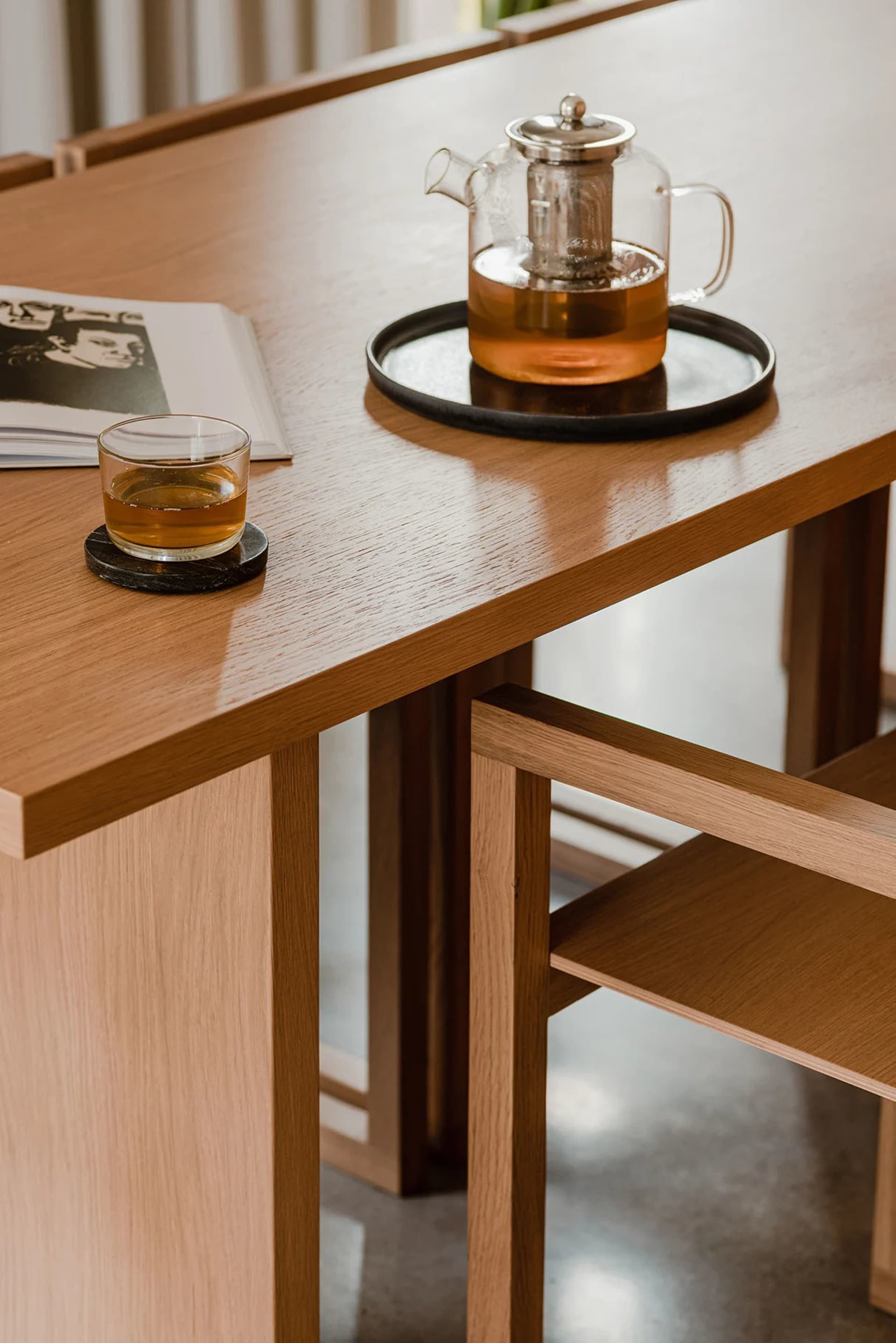 A photograph of a modern interior design featuring wooden furniture.