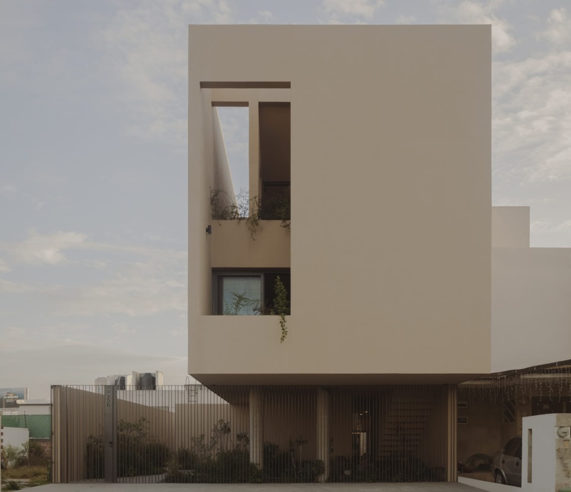 Modern, minimalist building exterior made of concrete.
