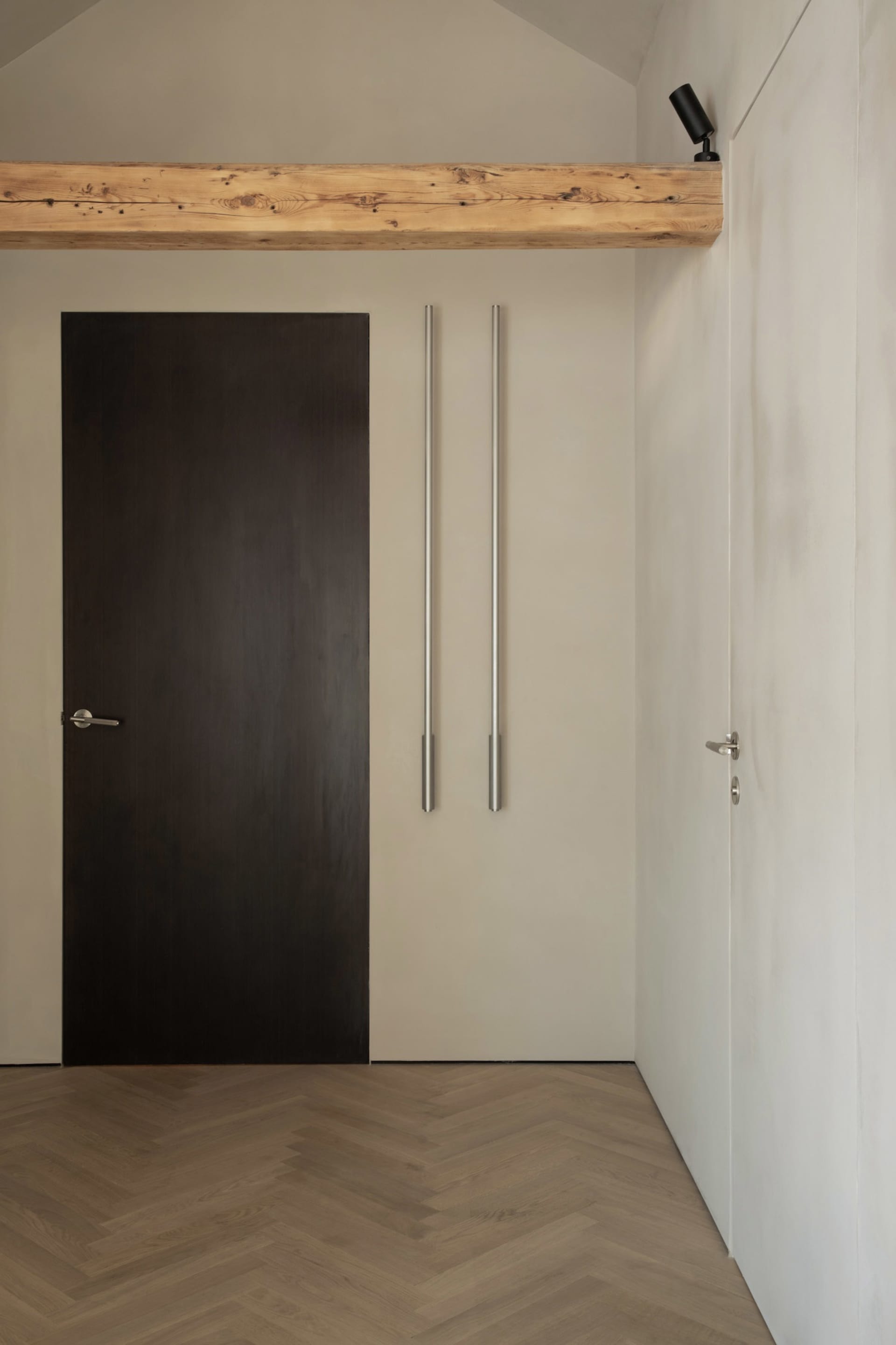 Modern minimalist residential interior featuring wooden flooring and concrete walls