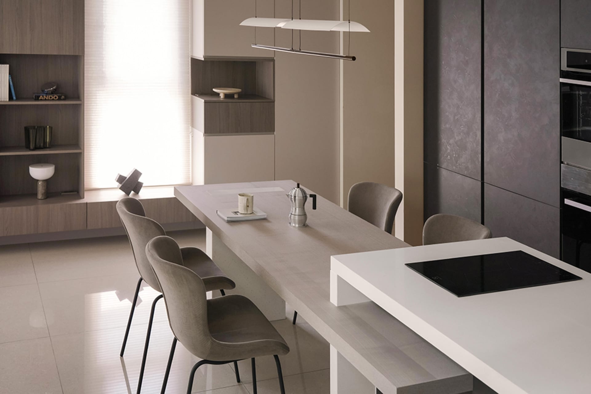 A modern minimalist kitchen with wooden countertops, stainless steel appliances, and a long island with a built-in cooktop an