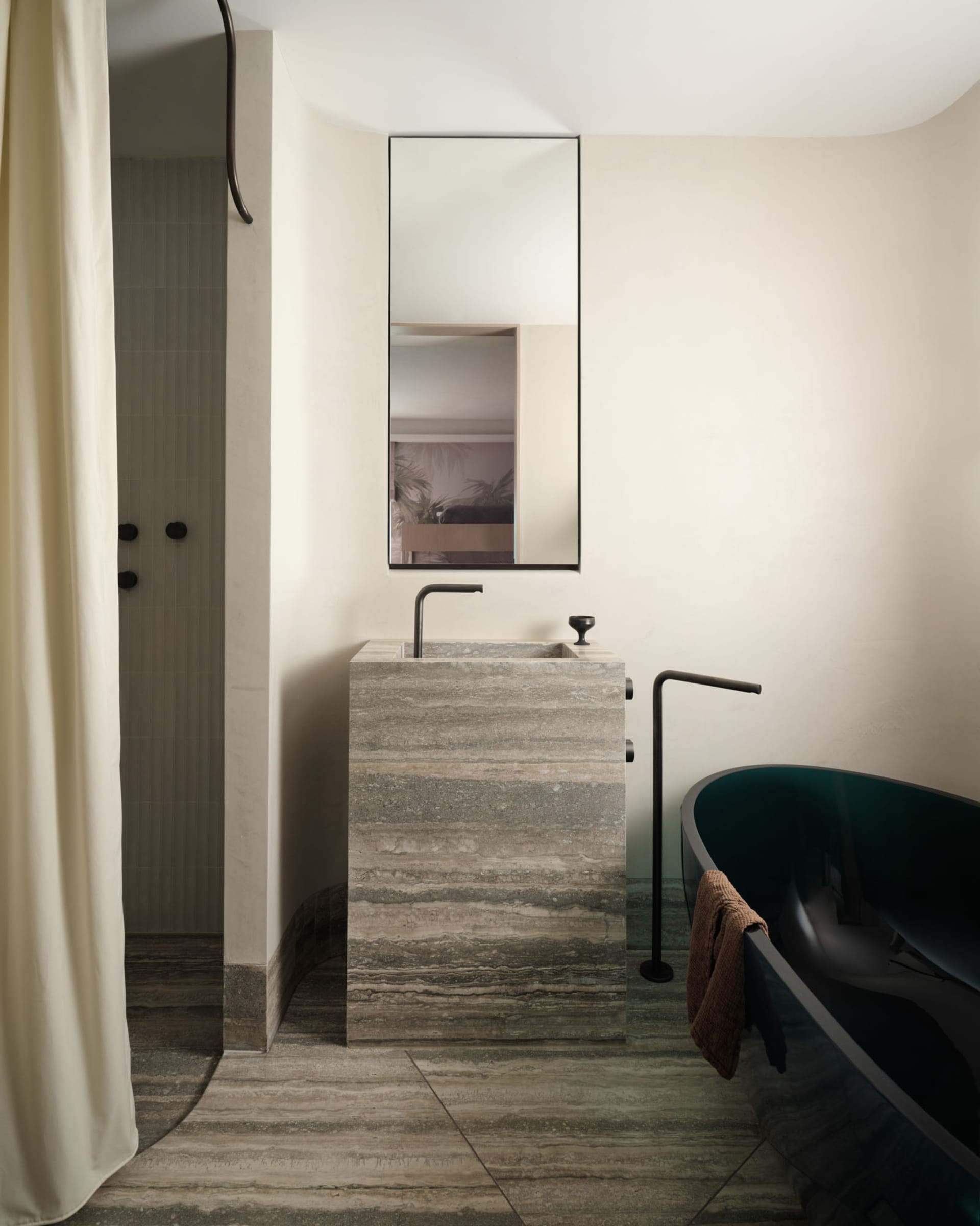 Modern minimalist bathroom with marble sink and black accents