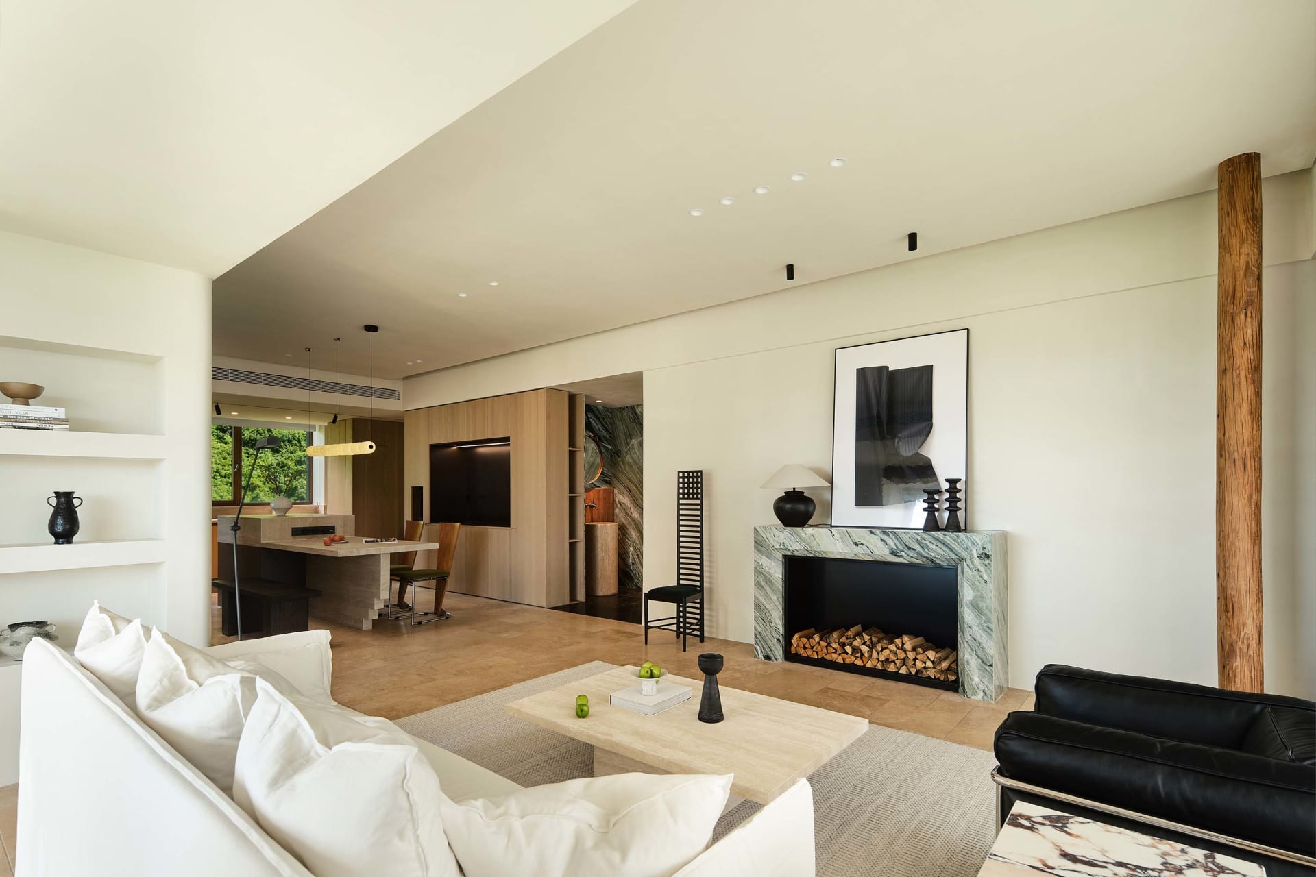 Modern interior design featuring marble elements in a spacious living room.