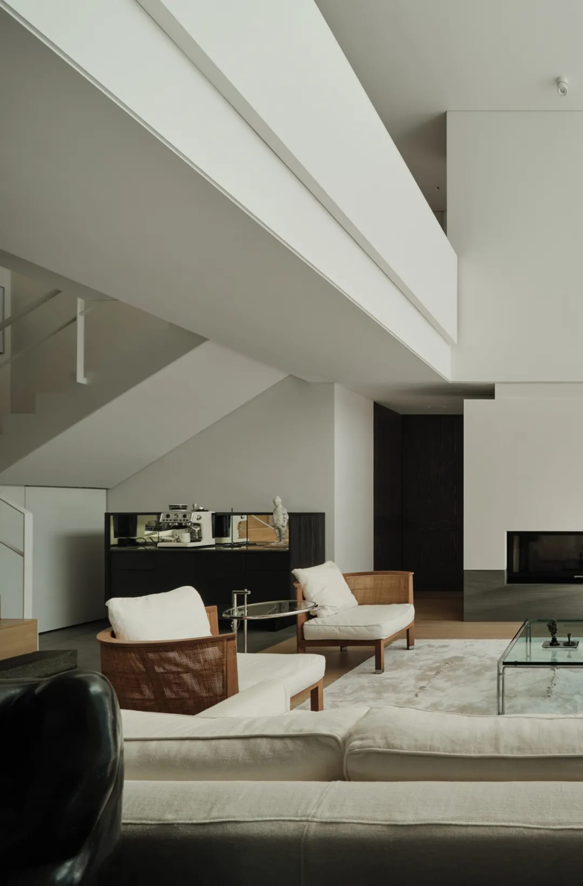 Modern living room featuring comfortable couches and minimalist decor.