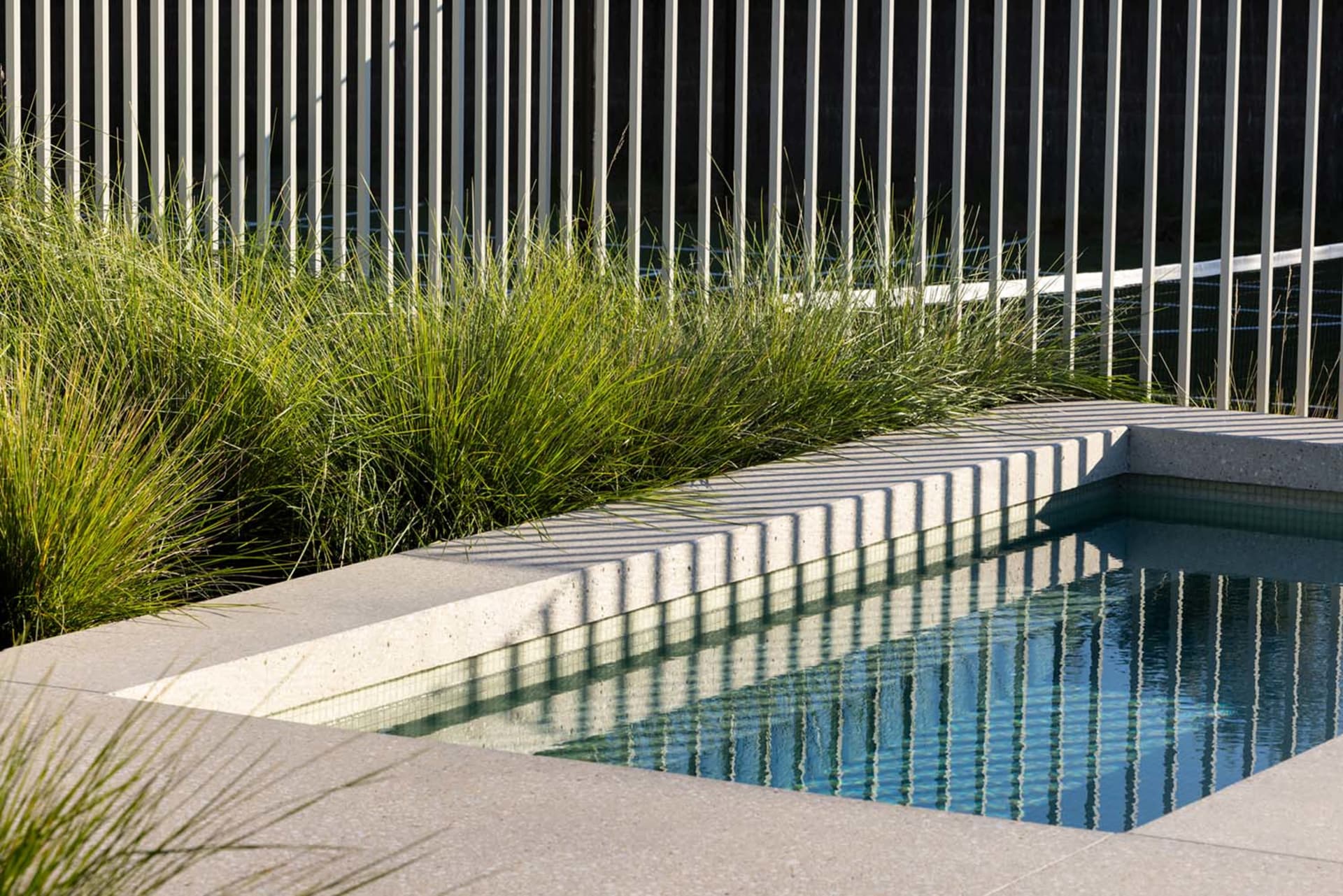 Modern sculpture with concrete surface and geometric, linear design elements
