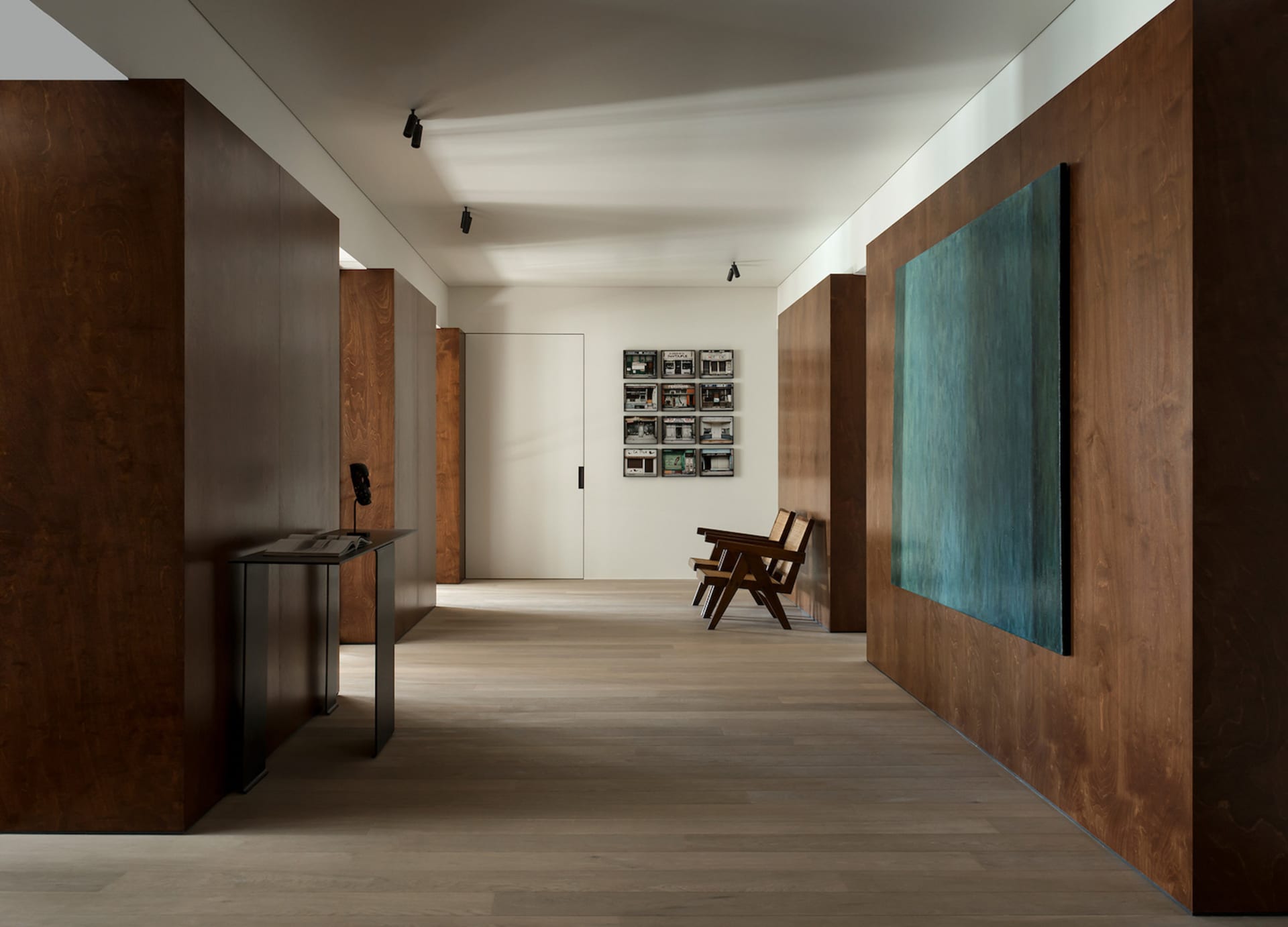 Minimalist art museum hall with wooden walls and metal accents