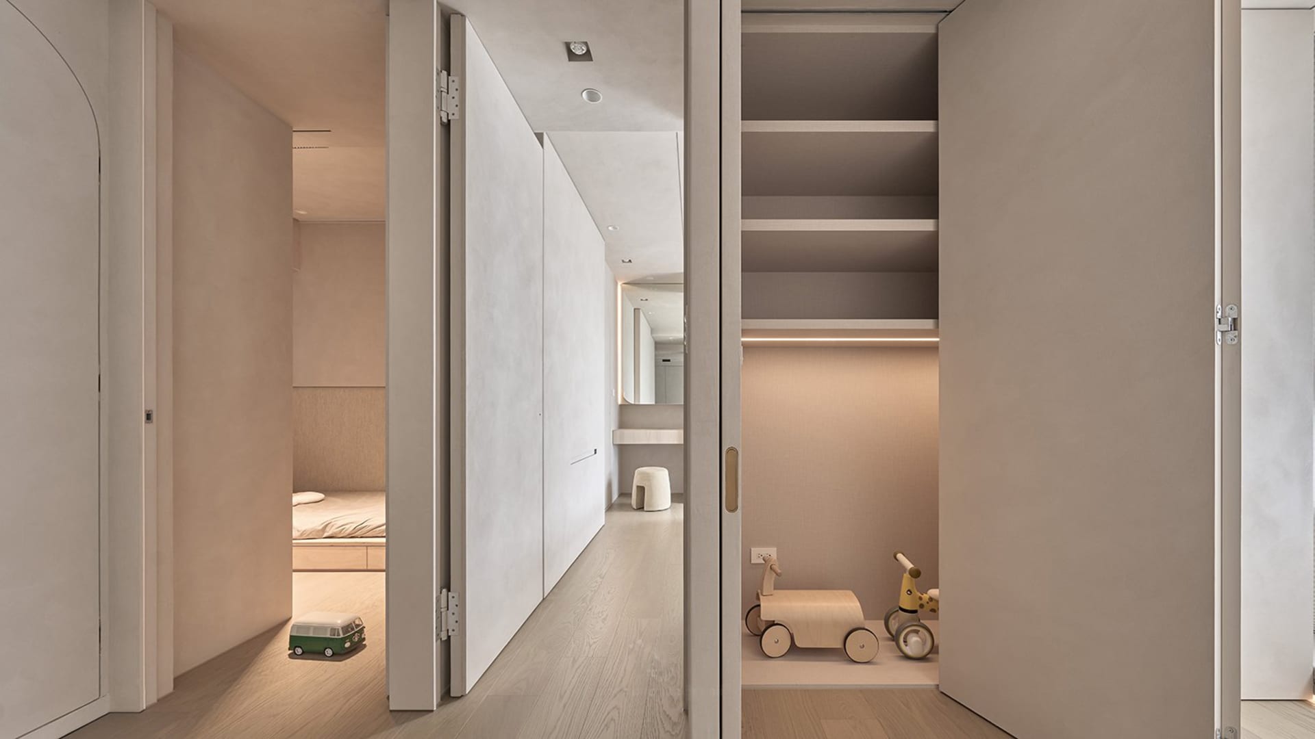 Minimalist residential interior showcasing sleek, light-colored wood and streamlined design elements.