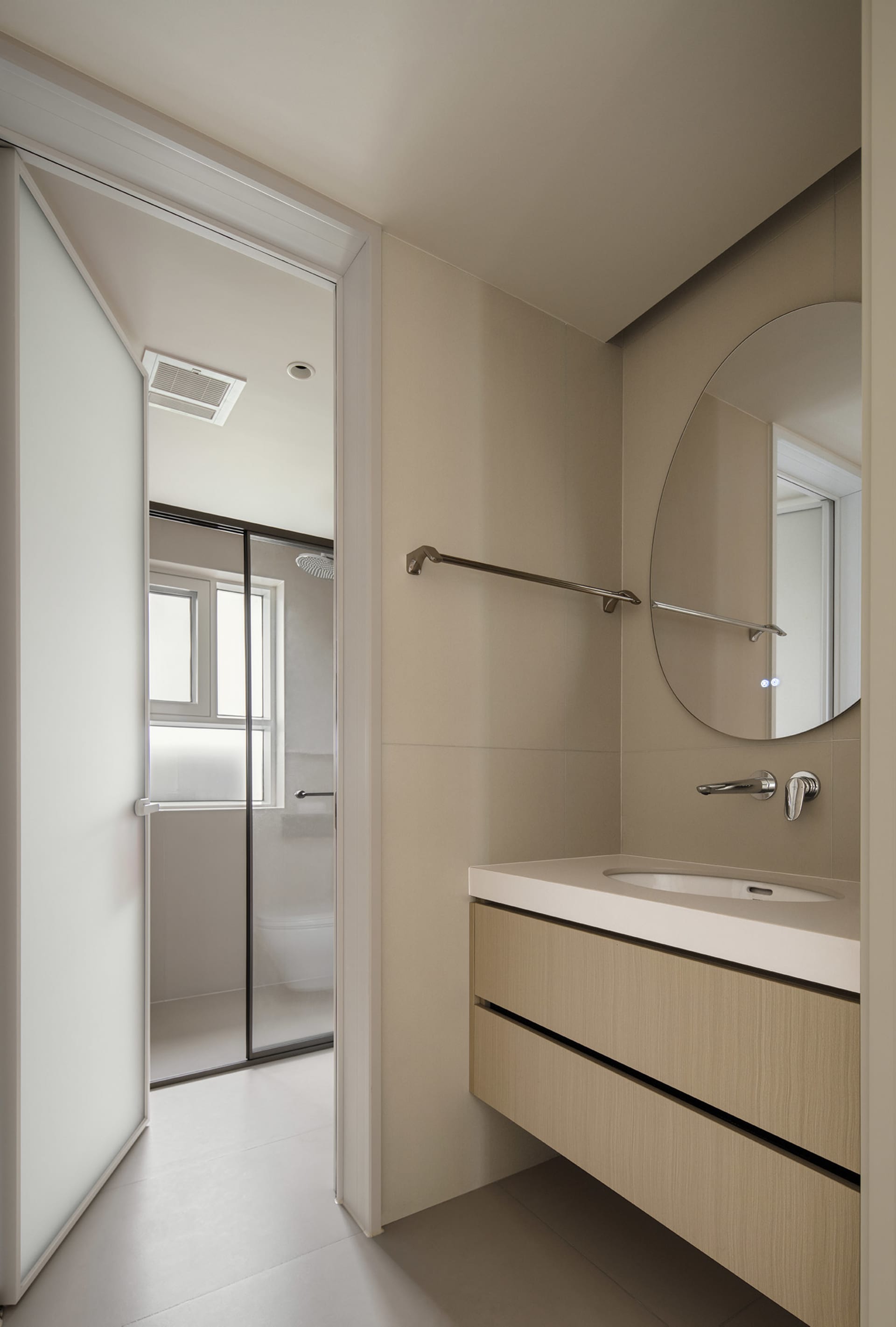 Modern bathroom with ceramic tiles and wooden vanity