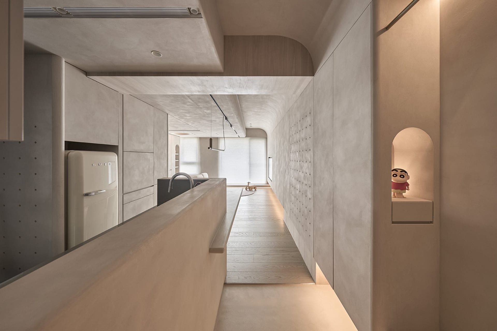 Modern residential interior with minimalist design and concrete walls.