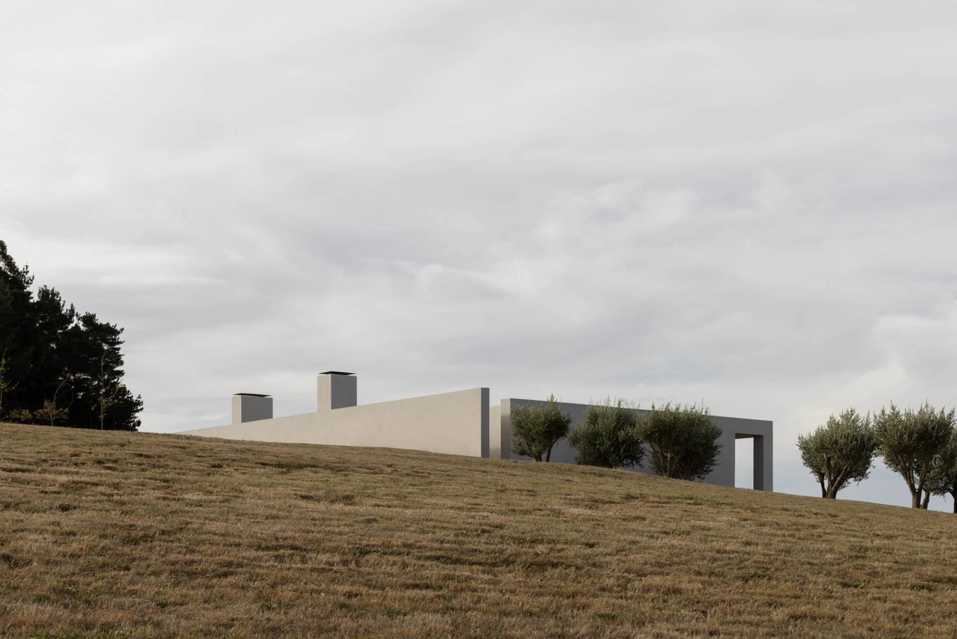 A modern building constructed with concrete materials, featuring a minimalist design.